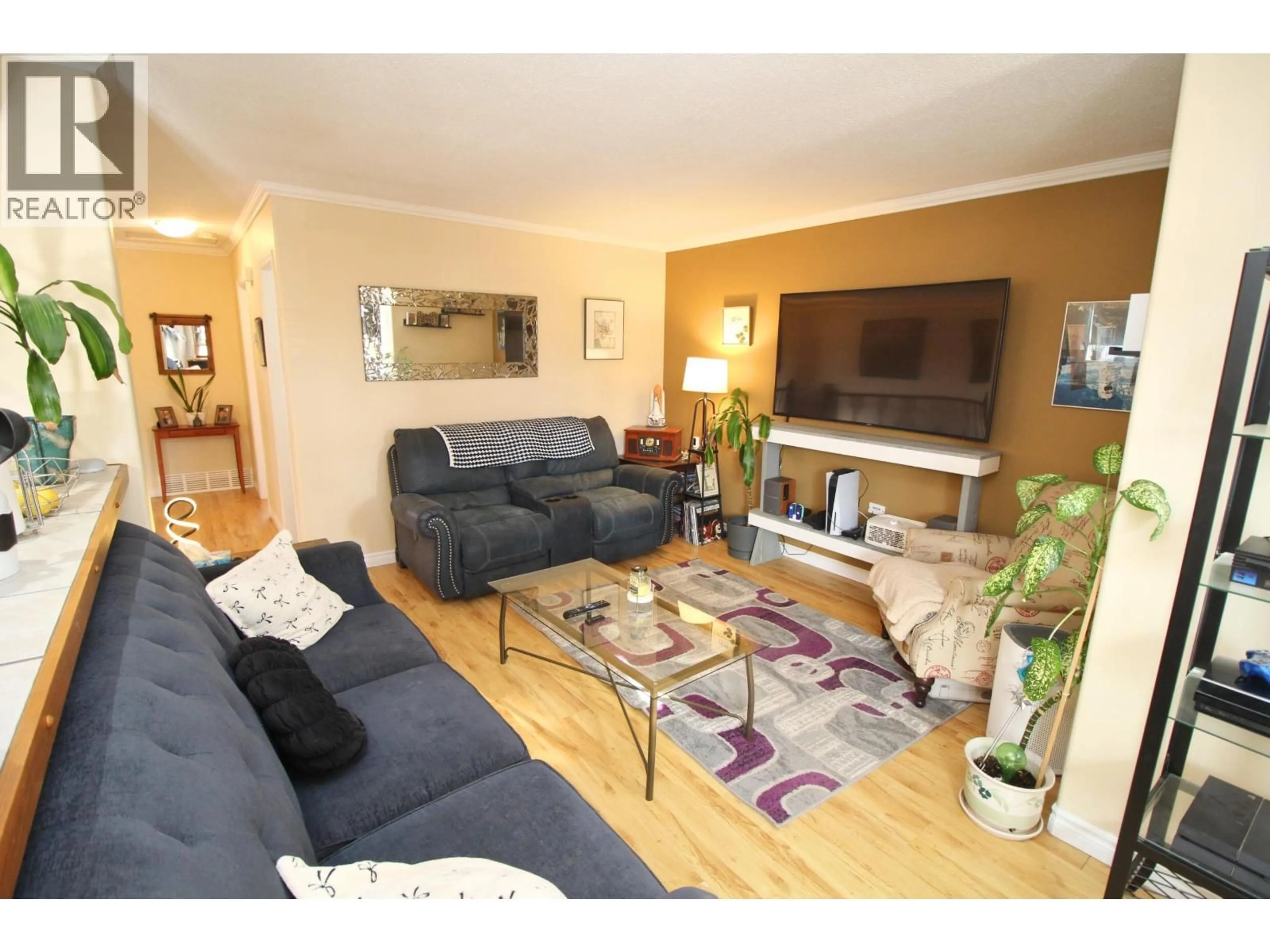 Living room with furniture, wood/laminate floor for 2201 CATALINE COURT, Houston British Columbia V0J1Z0