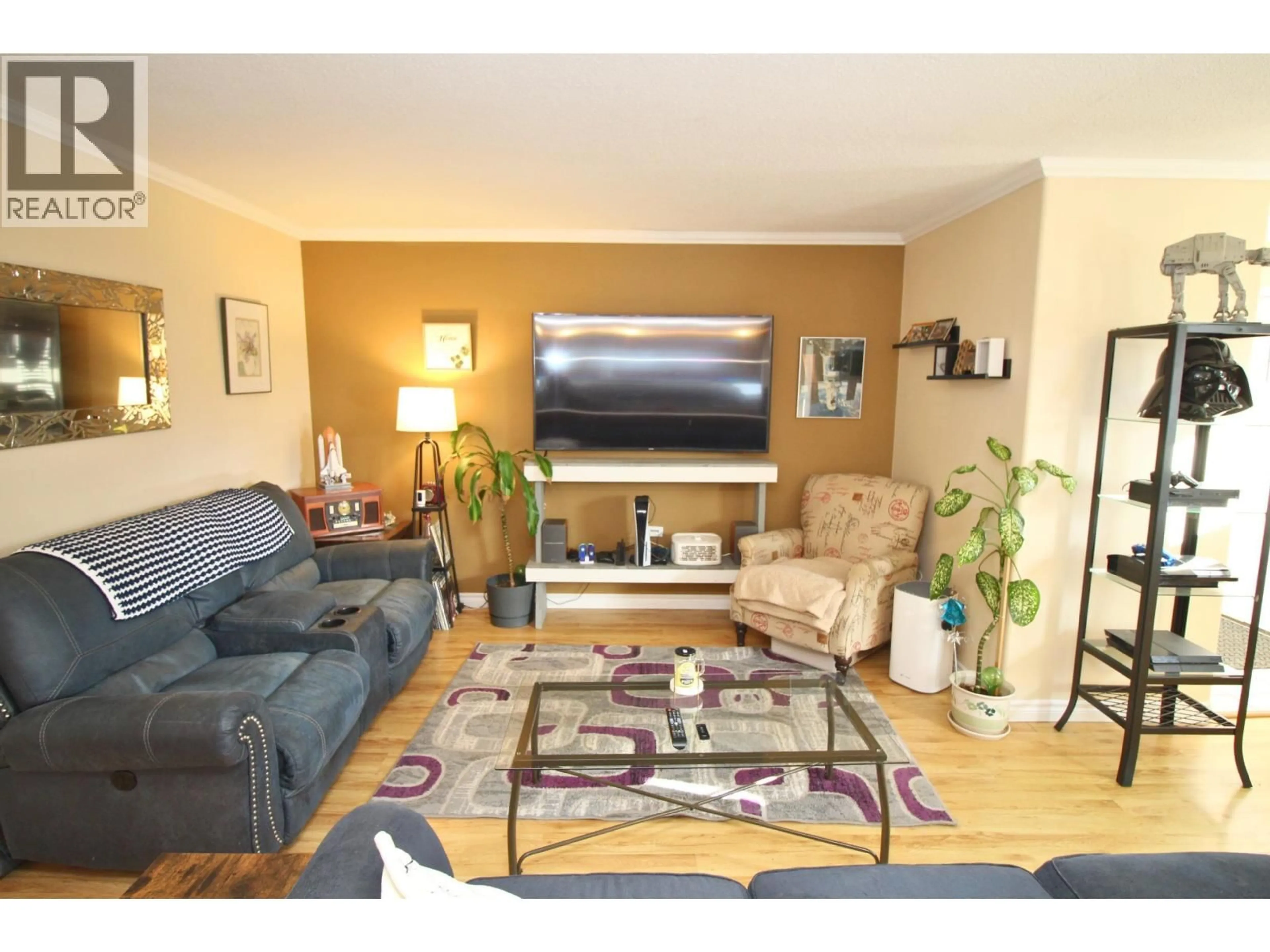 Living room with furniture, wood/laminate floor for 2201 CATALINE COURT, Houston British Columbia V0J1Z0