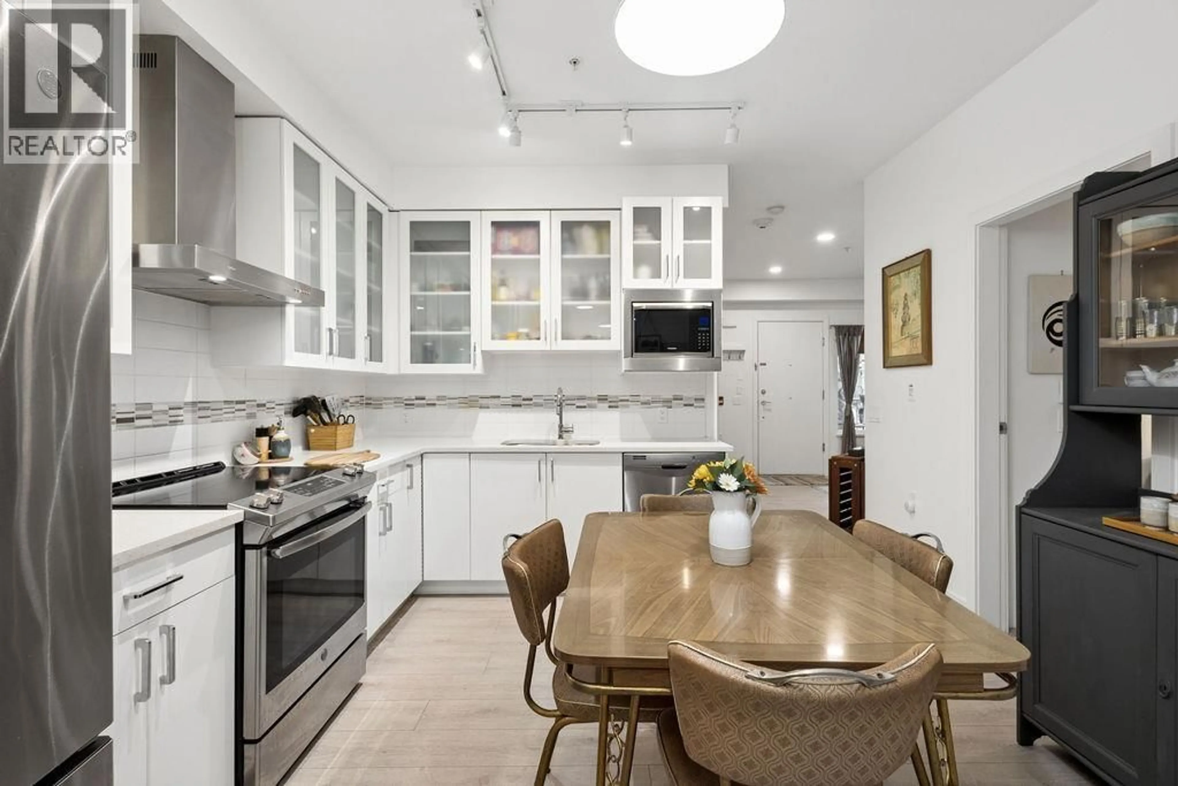 Open concept kitchen, ceramic/tile floor for 4860 SLOCAN STREET, Vancouver British Columbia V5R2A3