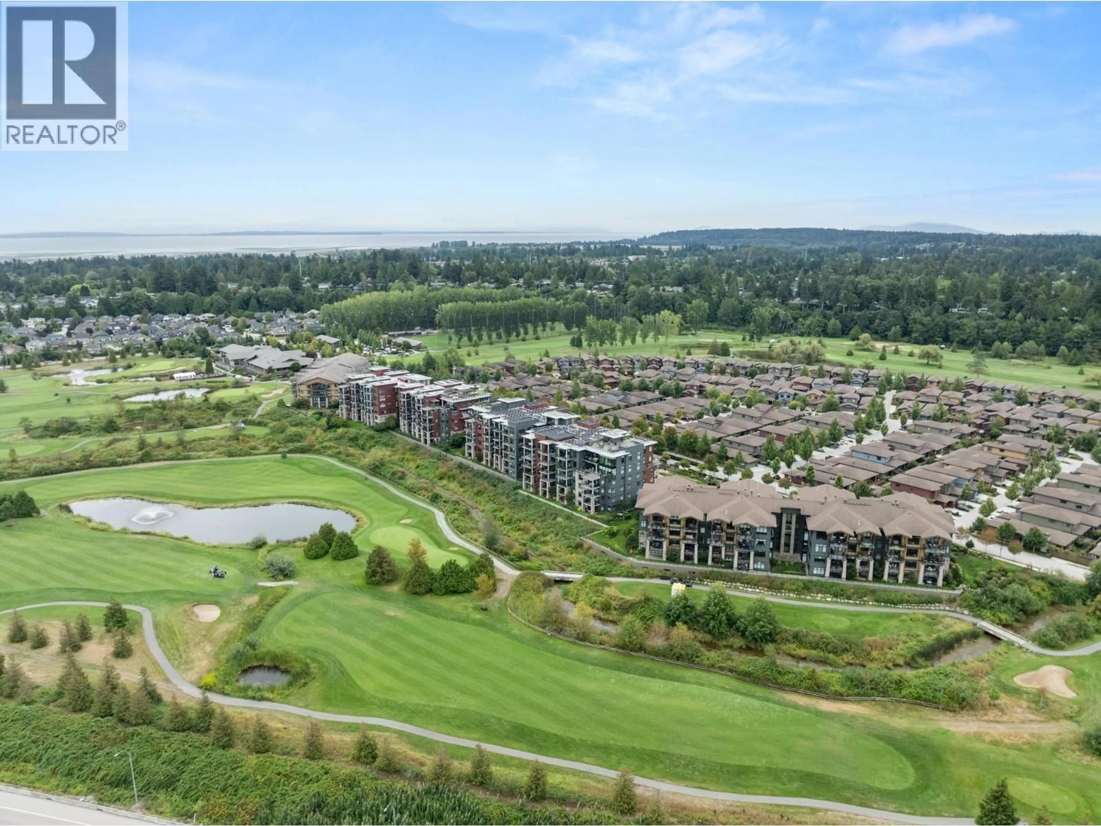 A pic from outside/outdoor area/front of a property/back of a property/a pic from drone, water/lake/river/ocean view for 408 - 4977 SPRINGS BOULEVARD, Delta British Columbia V4M0C1