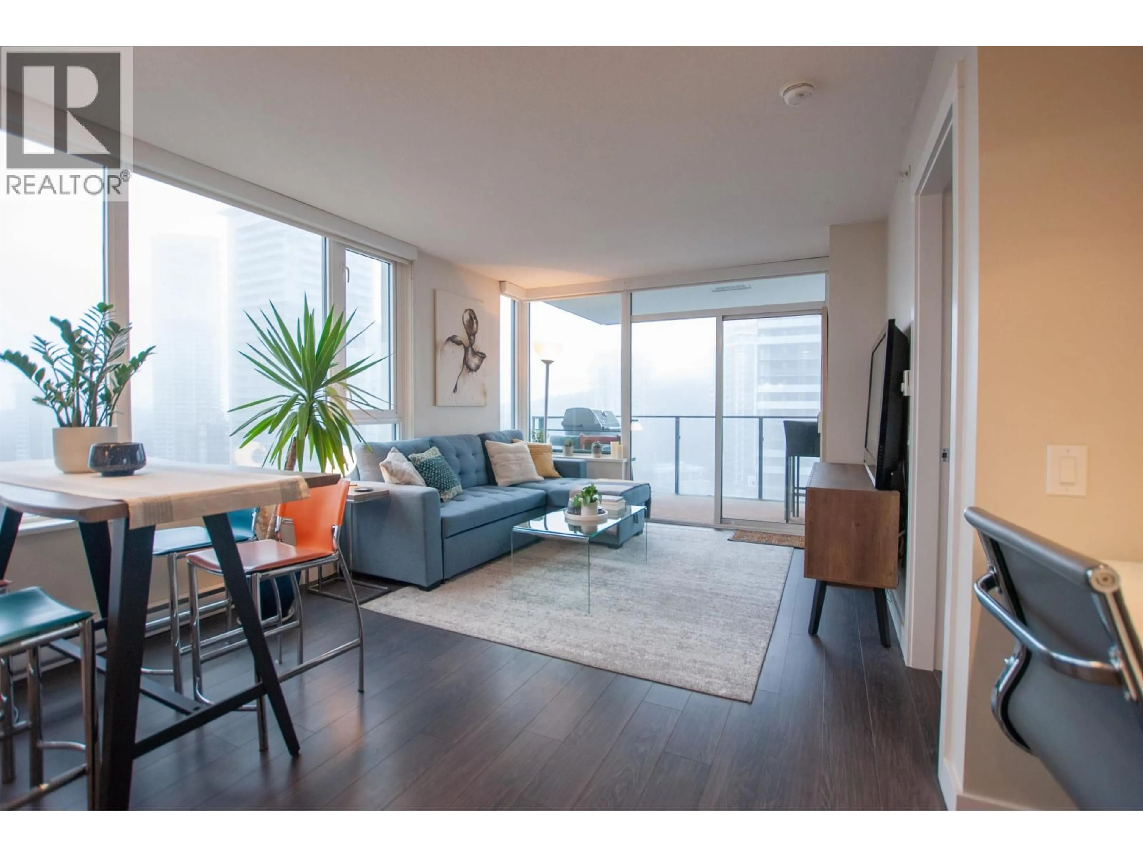 Living room with furniture, wood/laminate floor for 1507 - 602 COMO LAKE AVENUE, Coquitlam British Columbia V3J0G2