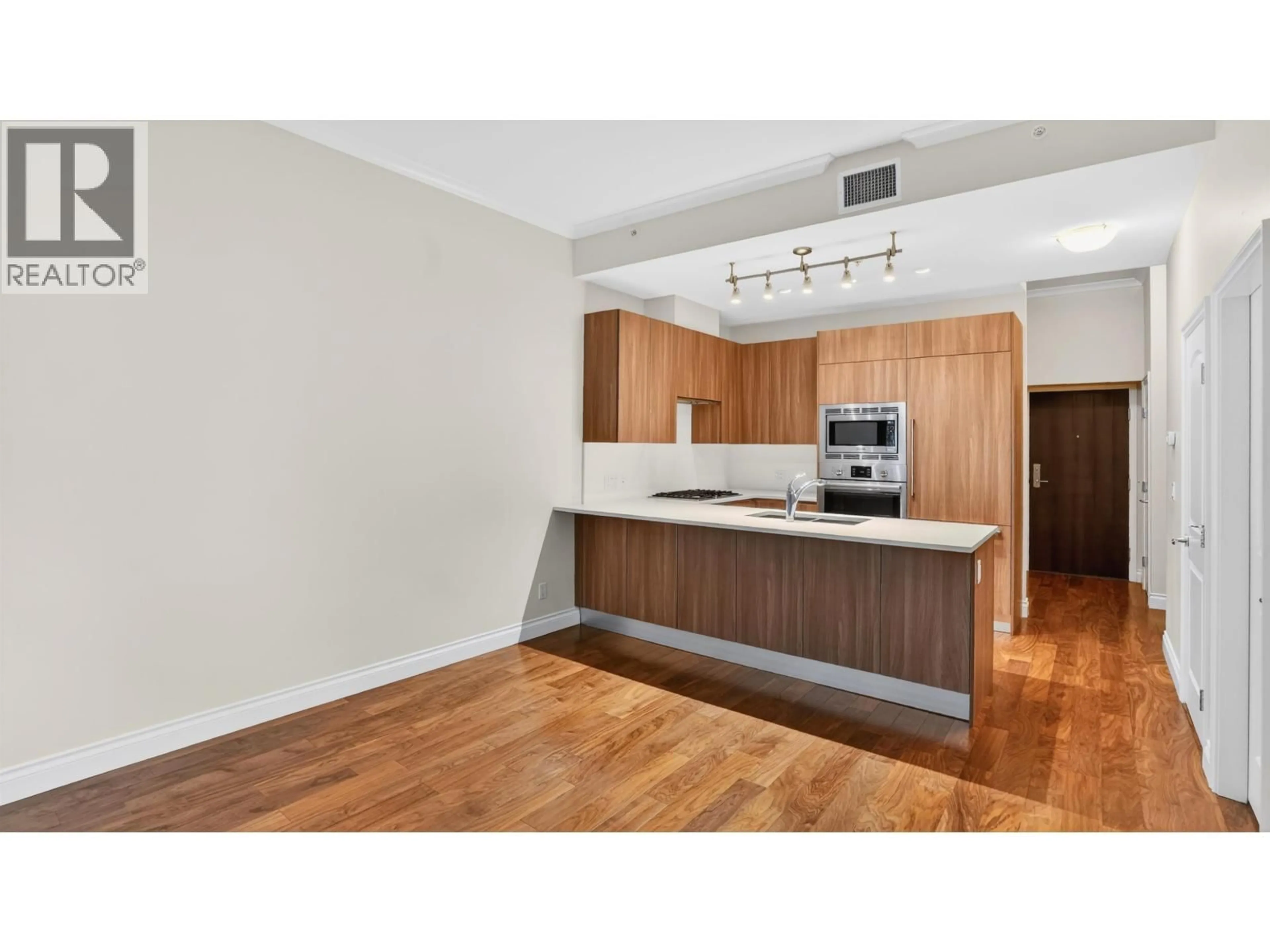 Standard kitchen, wood/laminate floor for 110 - 175 VICTORY SHIP WAY, North Vancouver British Columbia V7L0G1