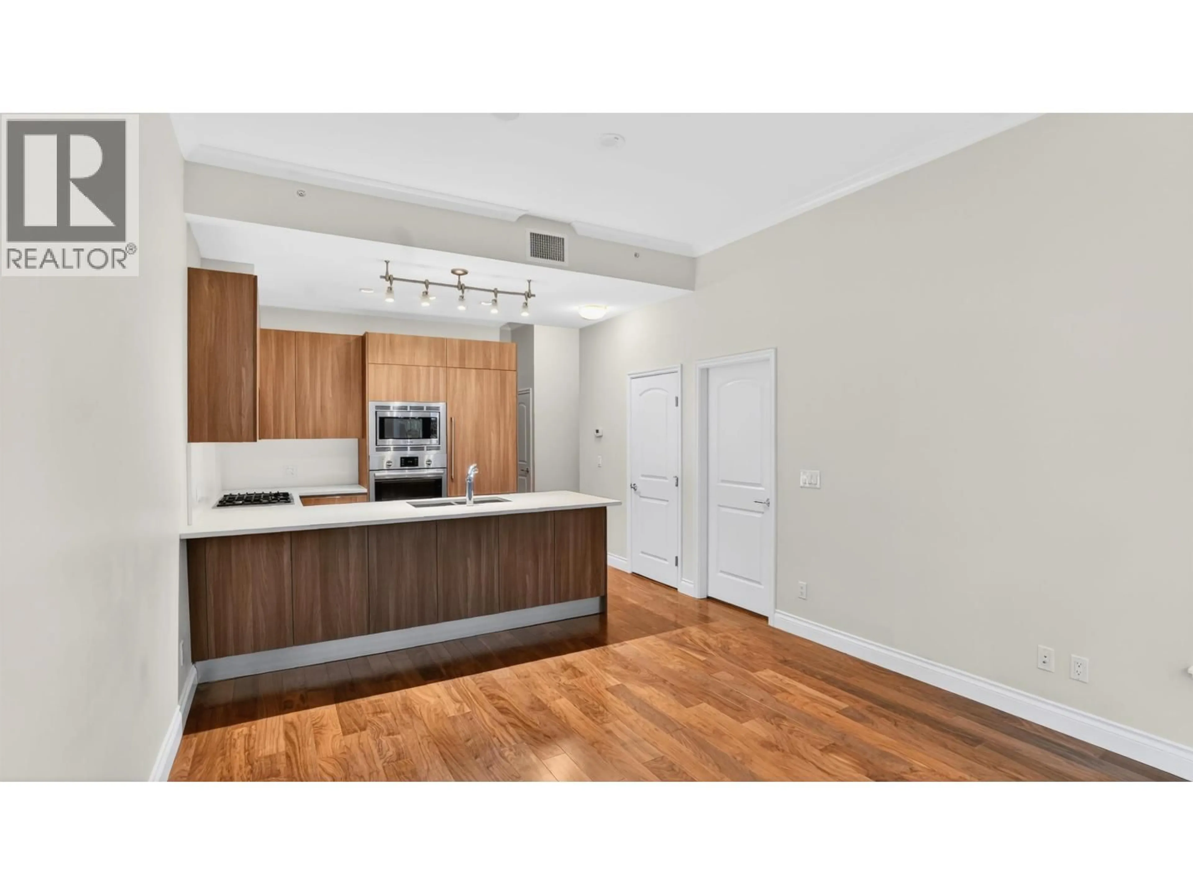 Standard kitchen, wood/laminate floor for 110 - 175 VICTORY SHIP WAY, North Vancouver British Columbia V7L0G1