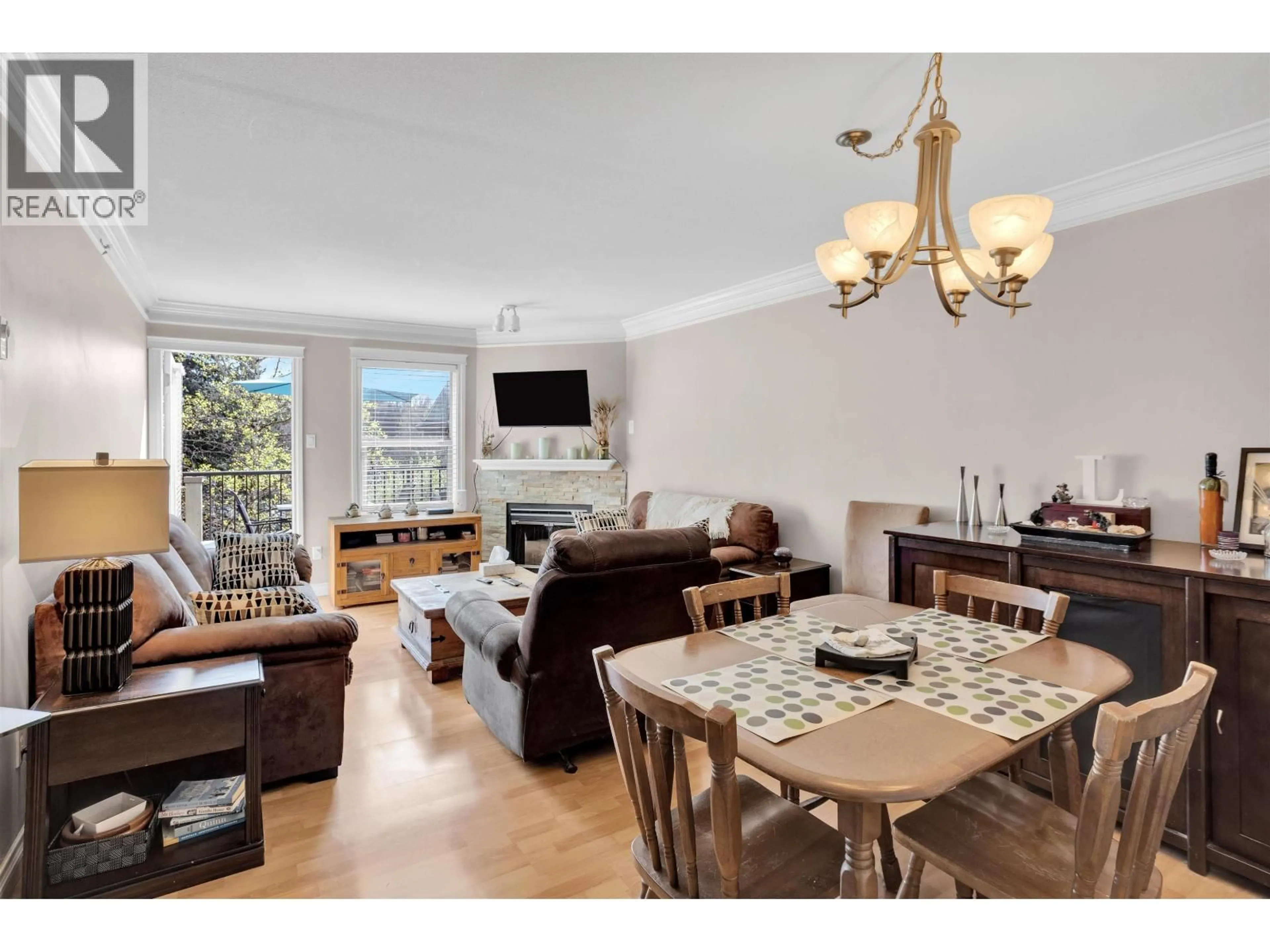 Living room with furniture, wood/laminate floor for 417 - 1591 BOOTH AVENUE, Coquitlam British Columbia V3K1B7