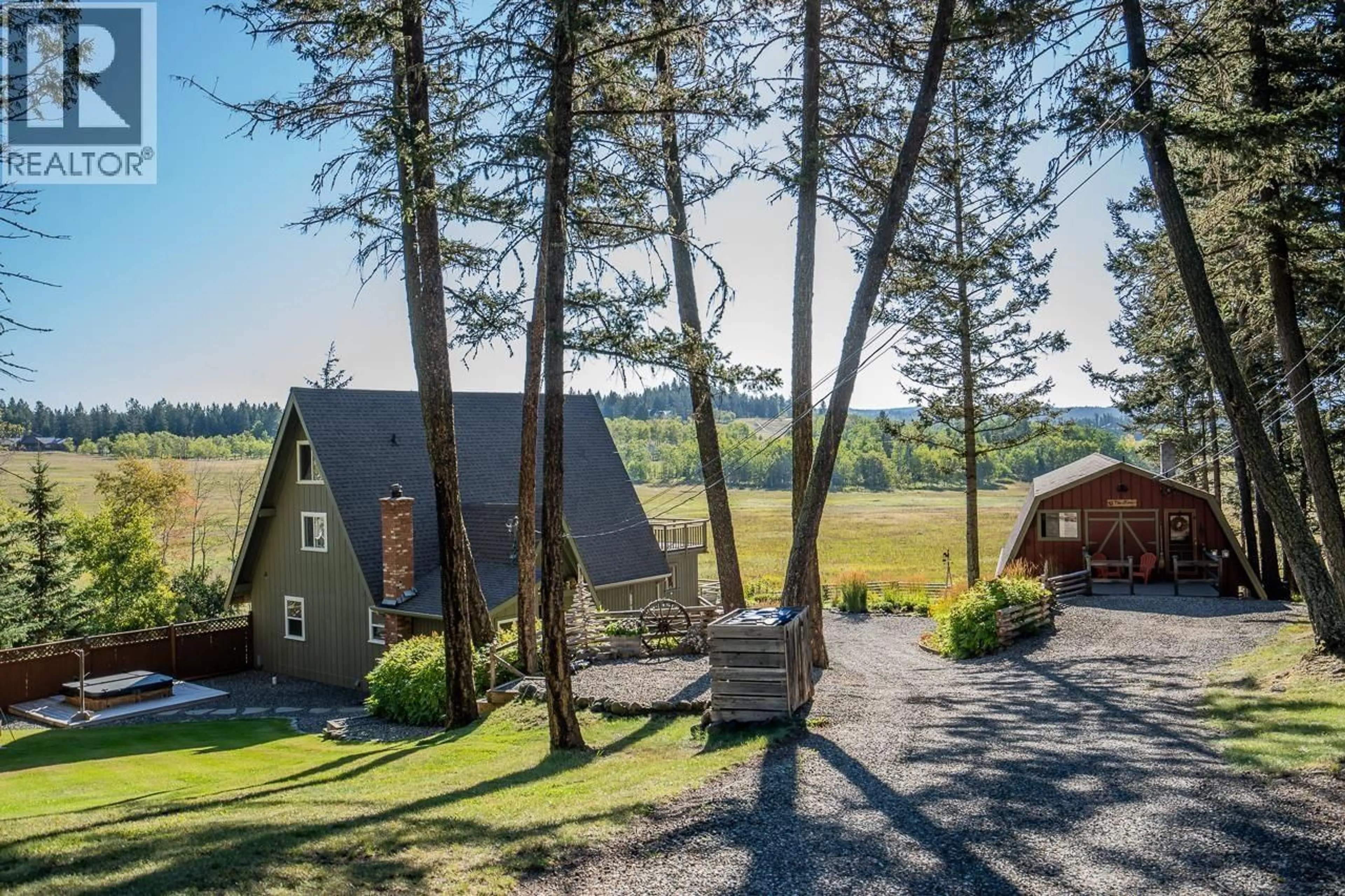 A pic from outside/outdoor area/front of a property/back of a property/a pic from drone, unknown for 5058 BLOCK DRIVE, 108 Mile Ranch British Columbia V0K2Z0