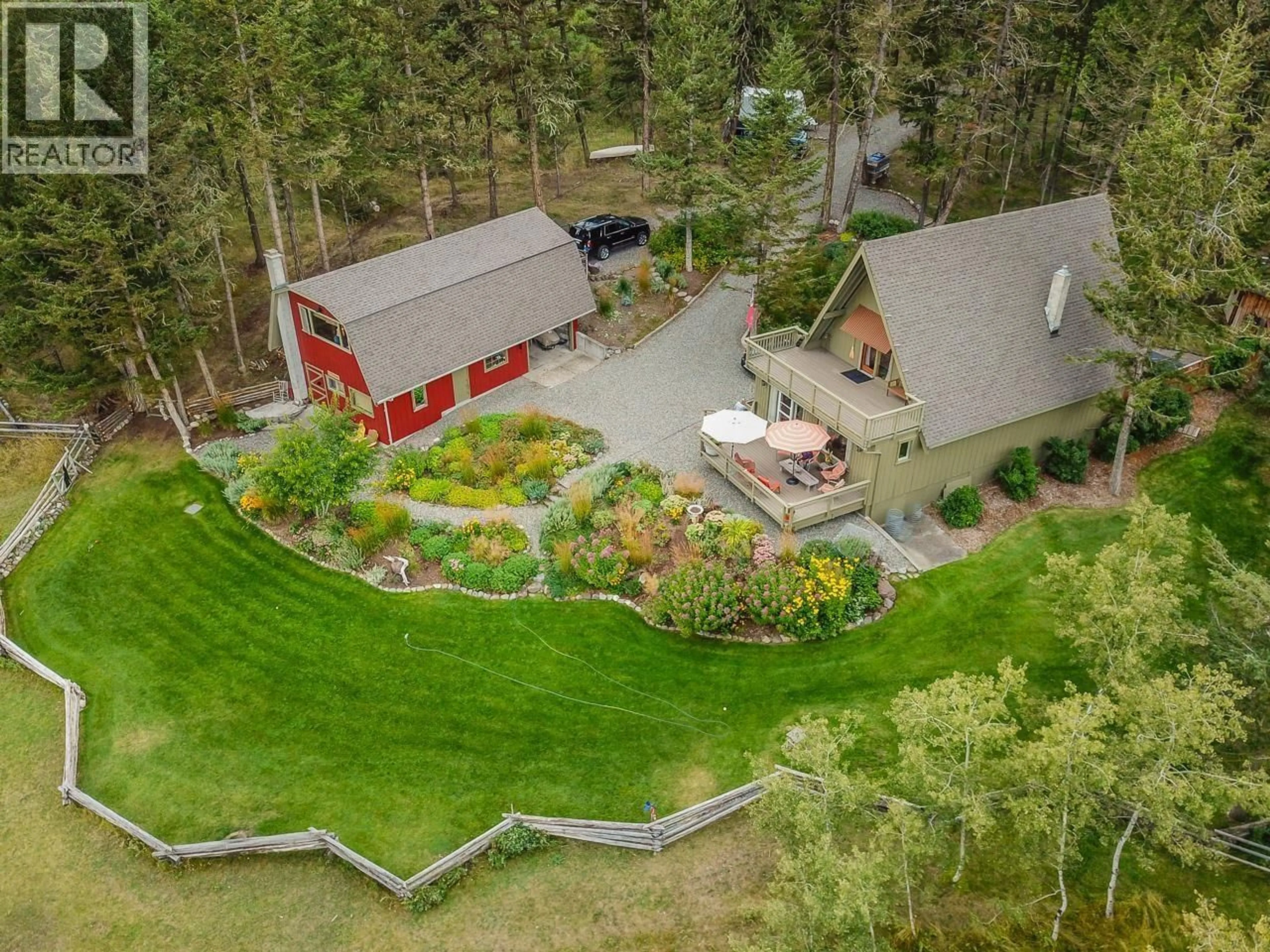 A pic from outside/outdoor area/front of a property/back of a property/a pic from drone, mountain view for 5058 BLOCK DRIVE, 108 Mile Ranch British Columbia V0K2Z0
