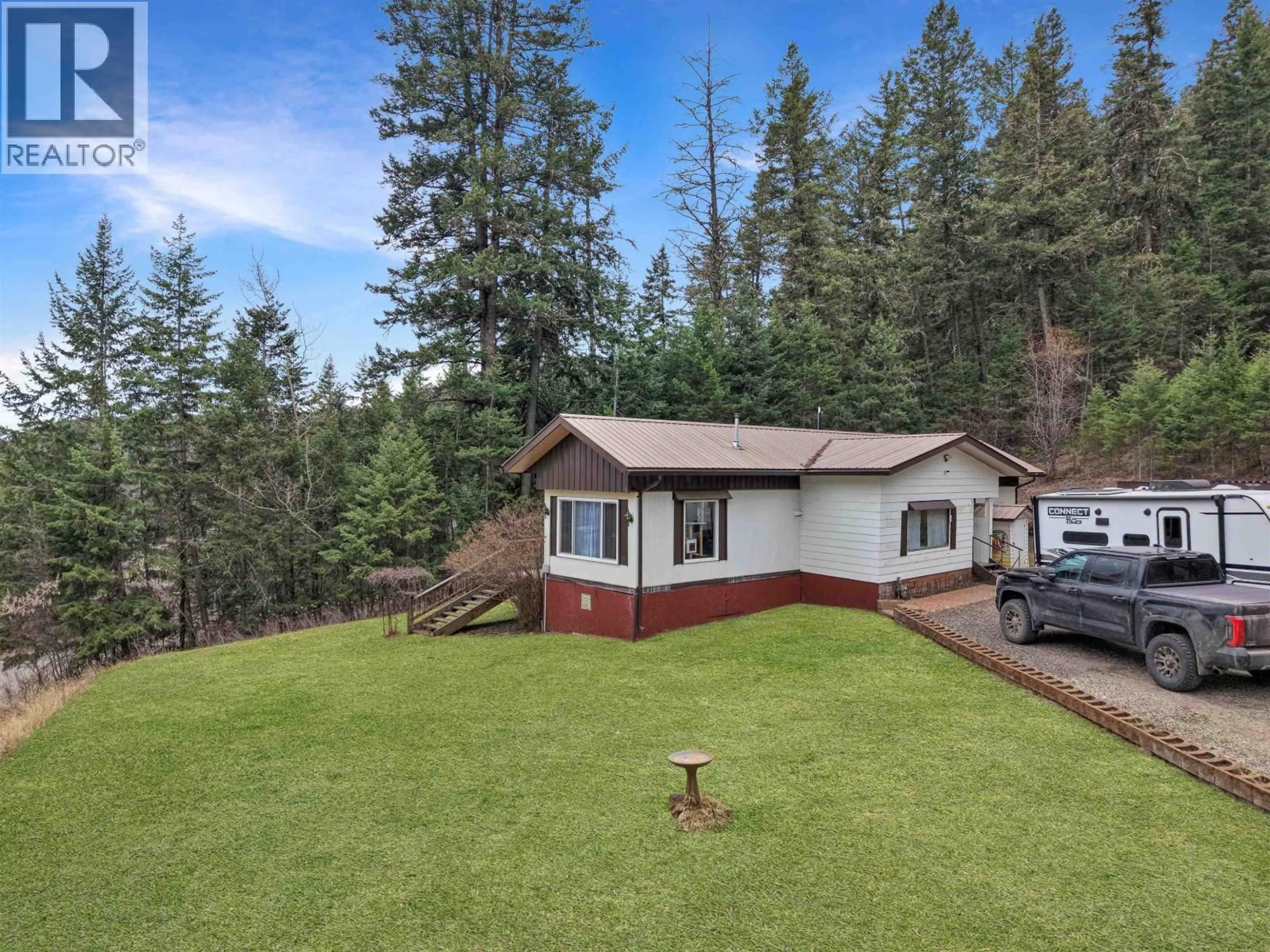 A pic from outside/outdoor area/front of a property/back of a property/a pic from drone, unknown for 913 HODGSON ROAD, Williams Lake British Columbia V2G4Y3