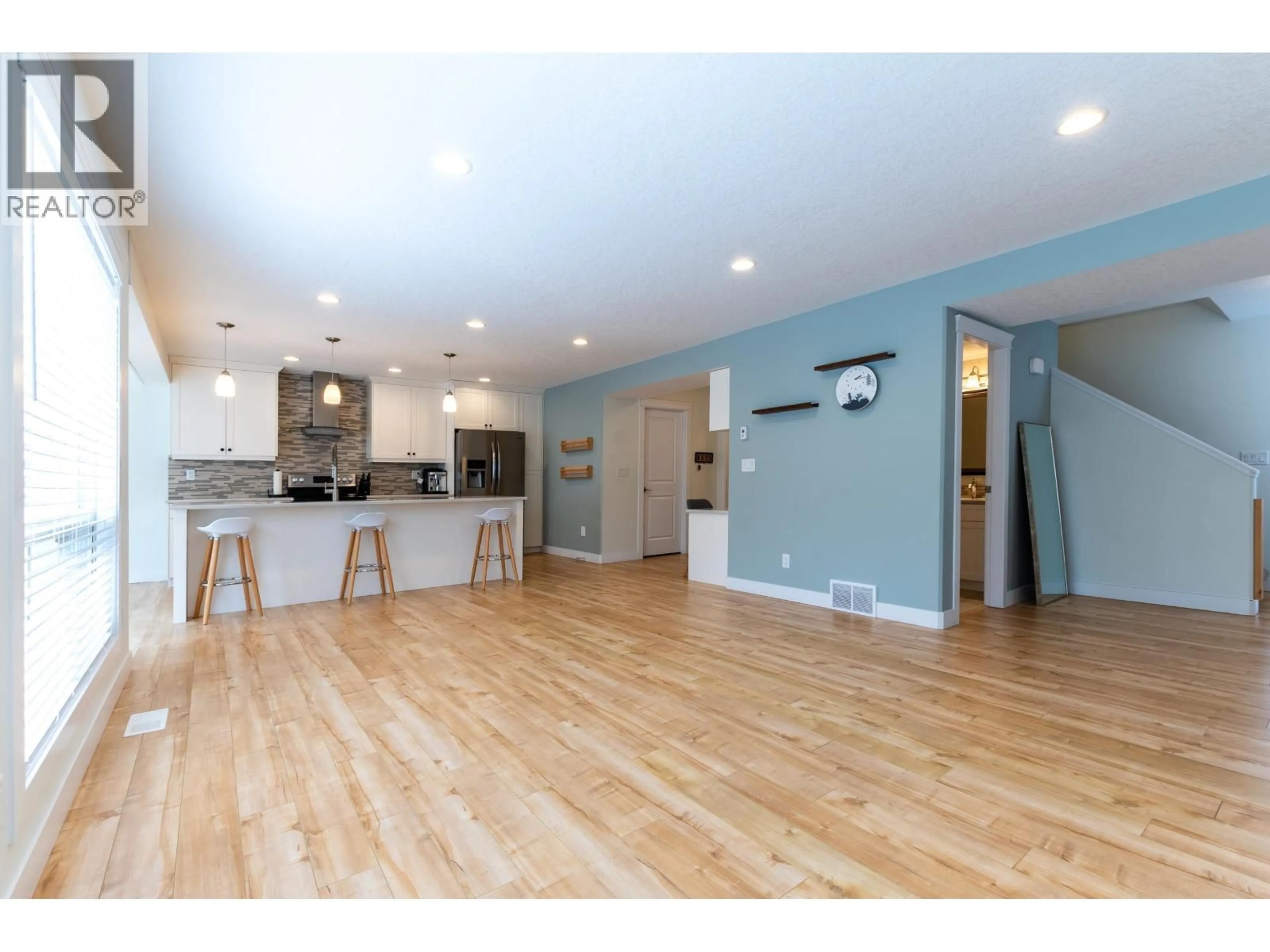 Open concept kitchen, wood/laminate floor for 8009 STILLWATER CRESCENT, Prince George British Columbia V2N0C2