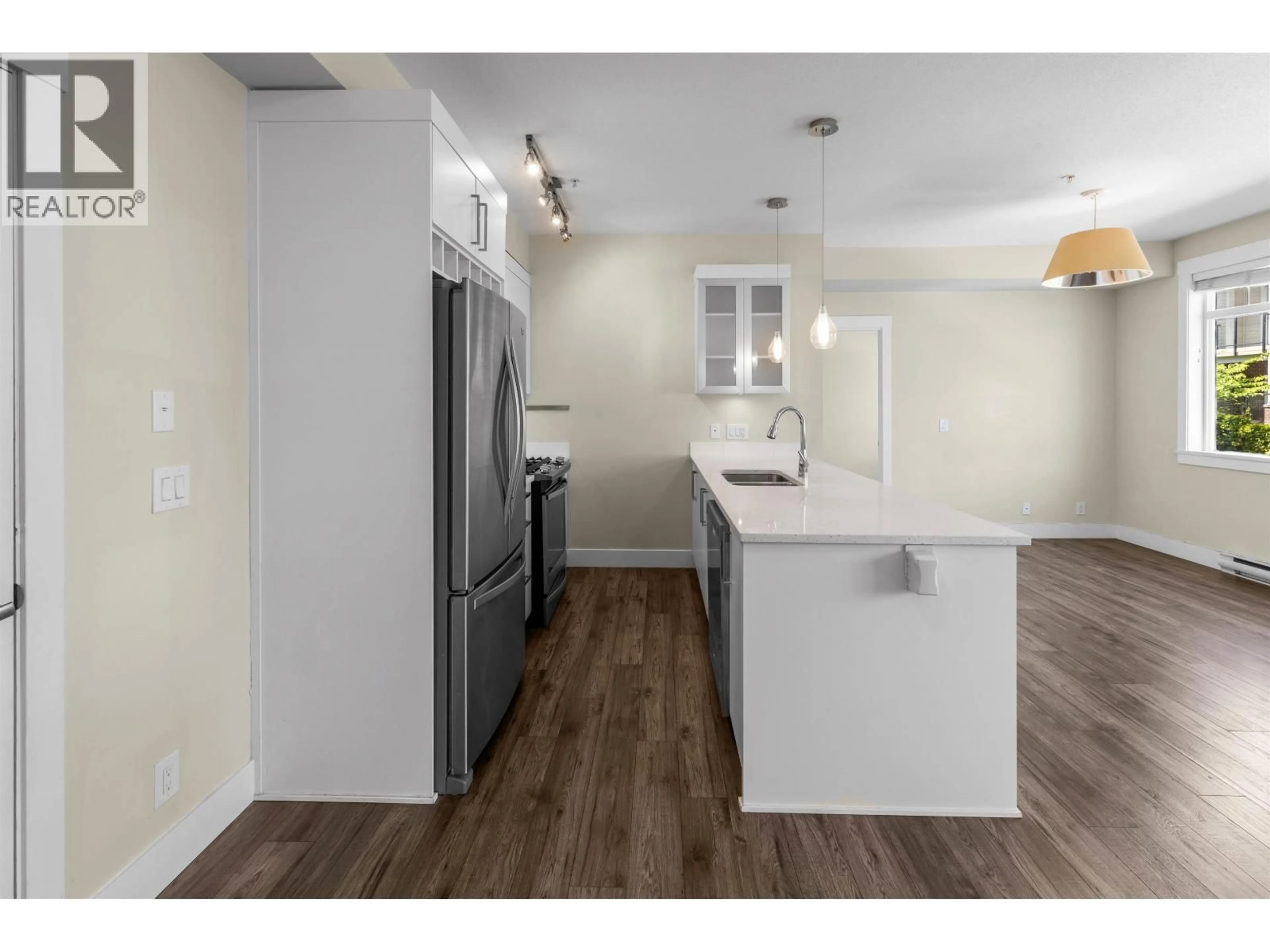 Open concept kitchen, wood/laminate floor for 311 - 22327 RIVER ROAD, Maple Ridge British Columbia V2X9C8