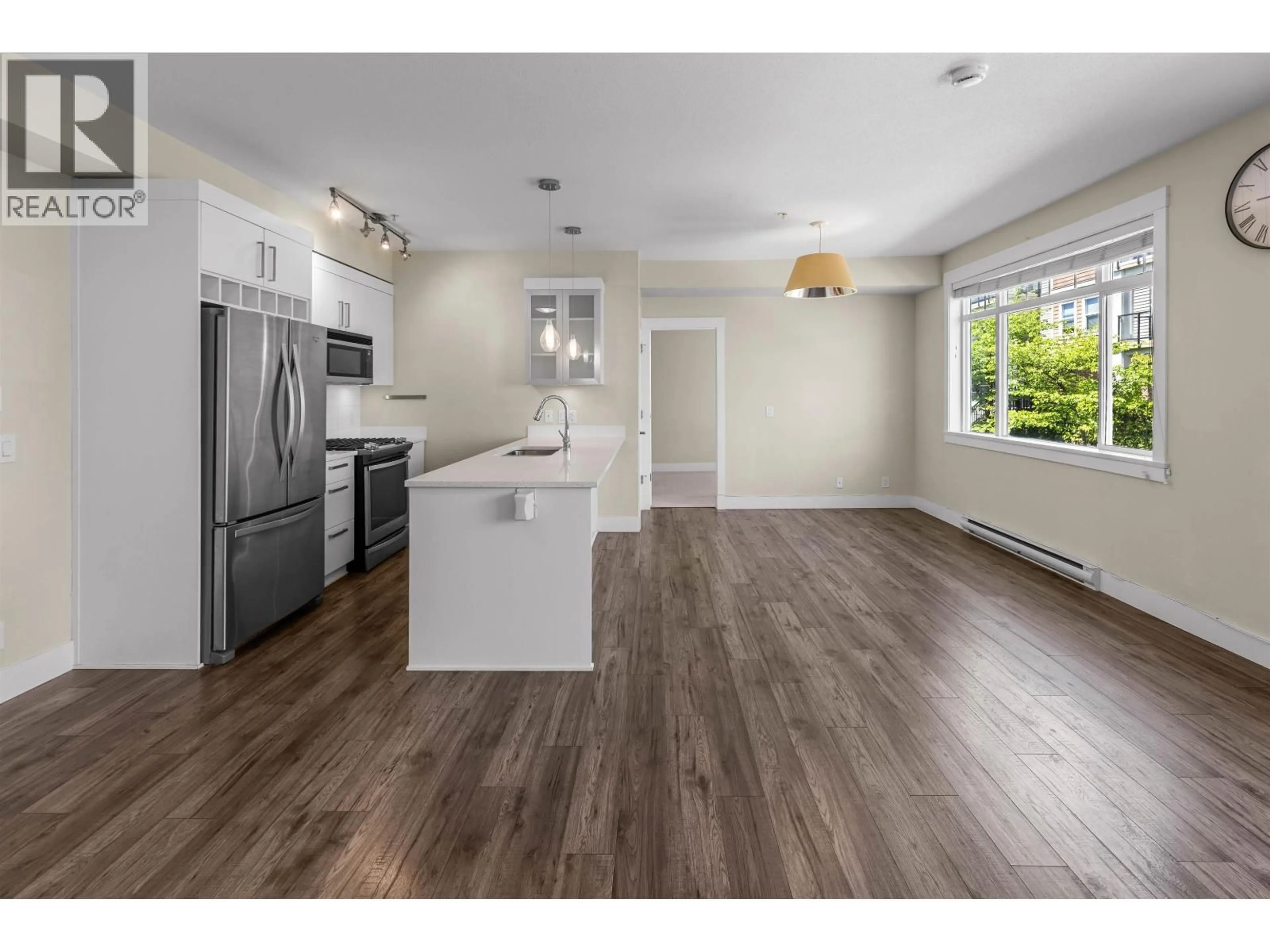 Open concept kitchen, wood/laminate floor for 311 - 22327 RIVER ROAD, Maple Ridge British Columbia V2X9C8