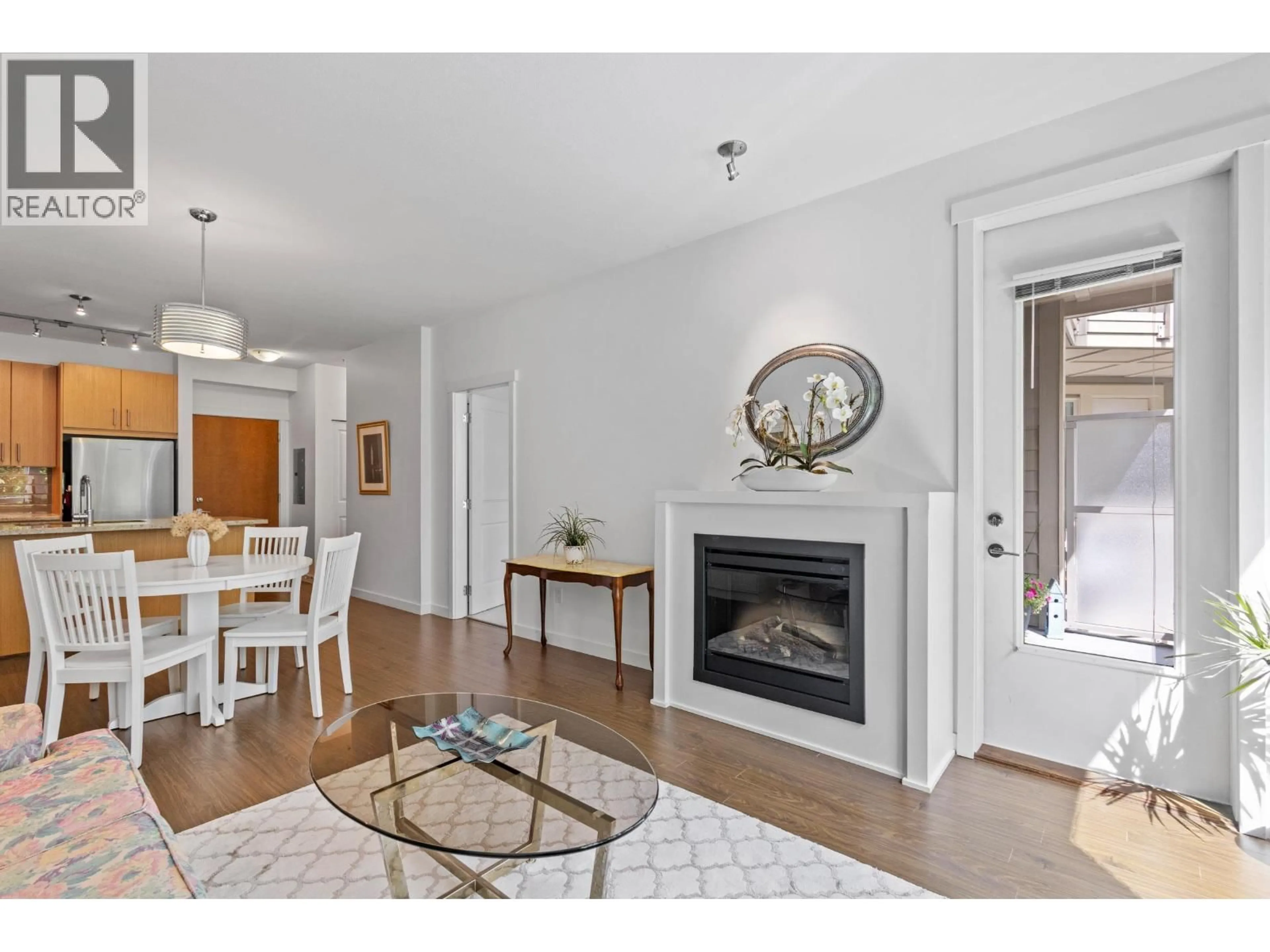 Living room with furniture, wood/laminate floor for 227 - 119 22ND STREET, North Vancouver British Columbia V7M0B4