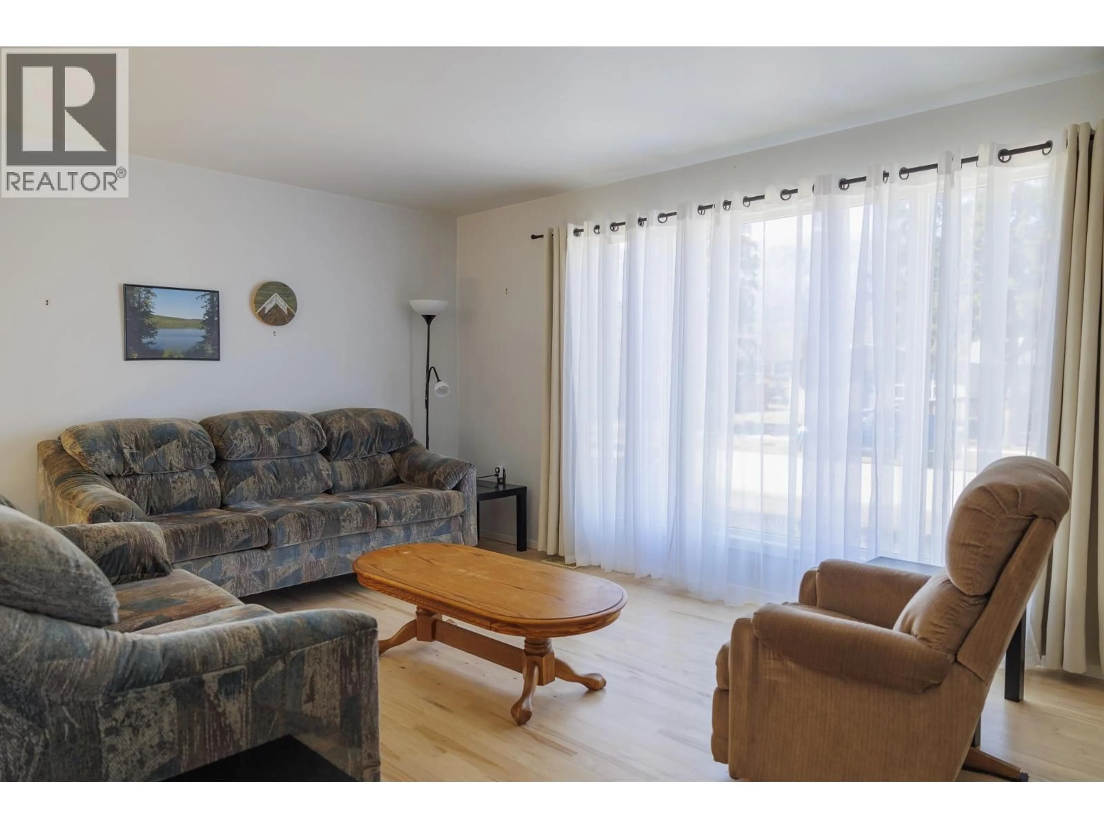 Living room with furniture, wood/laminate floor for 1128 3RD AVENUE, McBride British Columbia V0J2E0