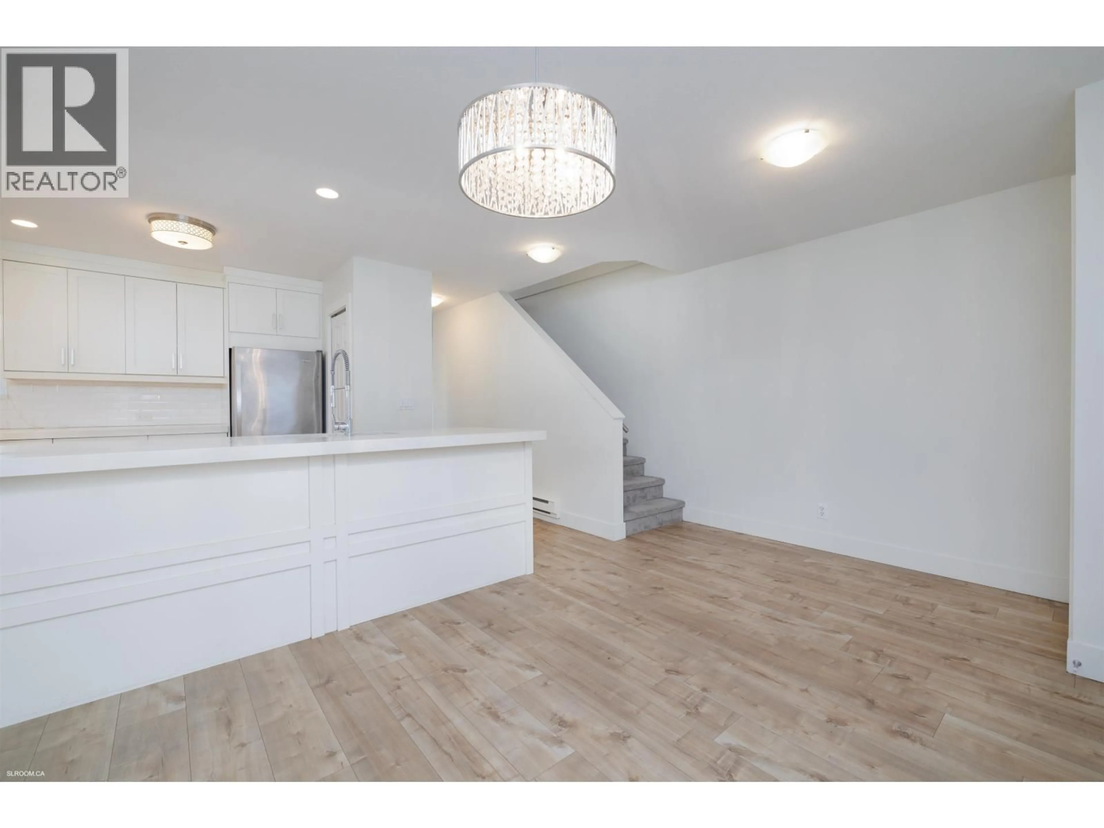 Open concept kitchen, wood/laminate floor for 140 SHORELINE CIRCLE, Port Moody British Columbia V3H5B3