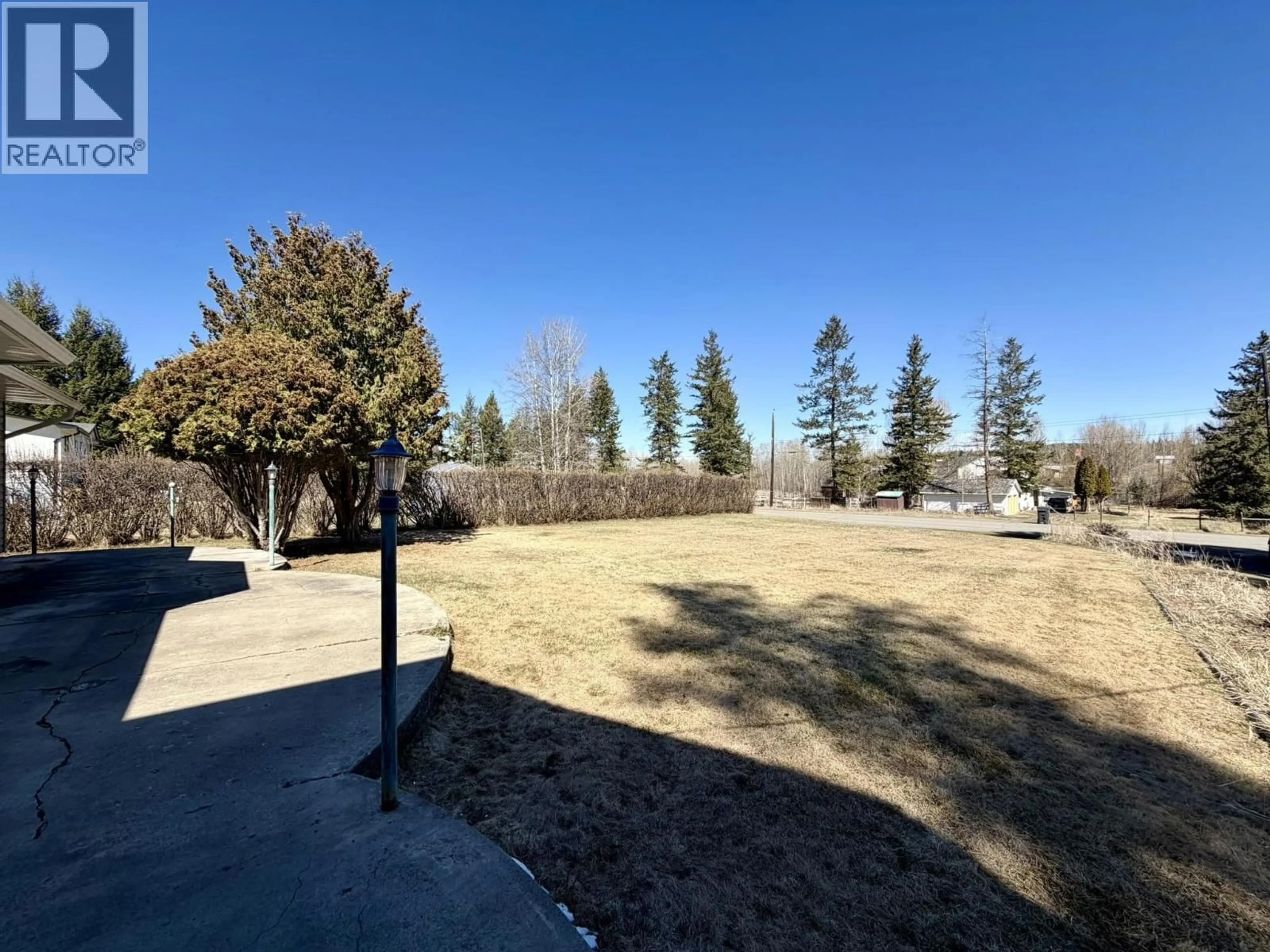 A pic from outside/outdoor area/front of a property/back of a property/a pic from drone, forest/trees view for 4994 DONSLEEQUA ROAD, 108 Mile Ranch British Columbia V0K2Z0