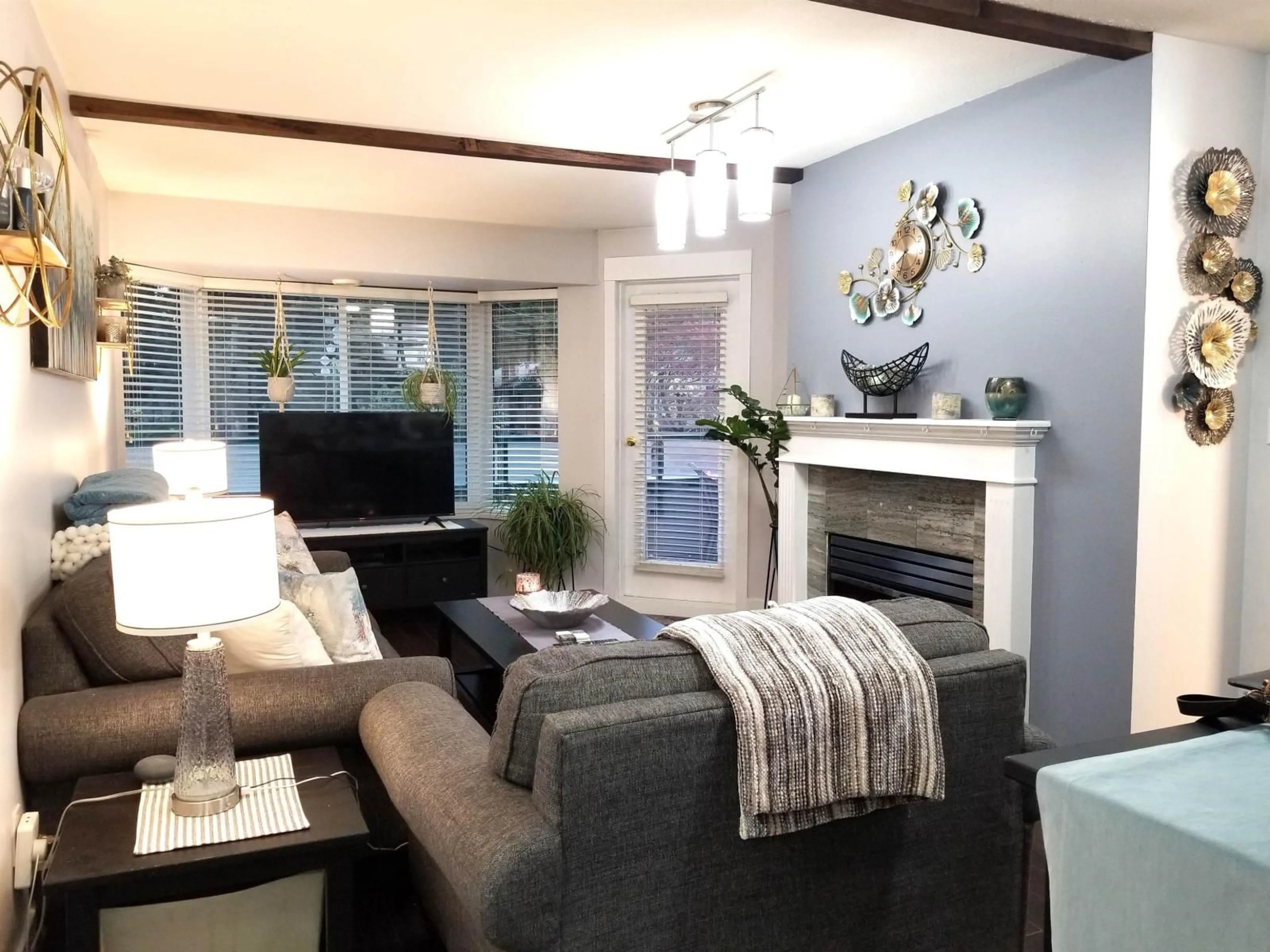 Living room with furniture, wood/laminate floor for 208 - 2964 TRETHEWEY STREET, Abbotsford British Columbia V2T6P4