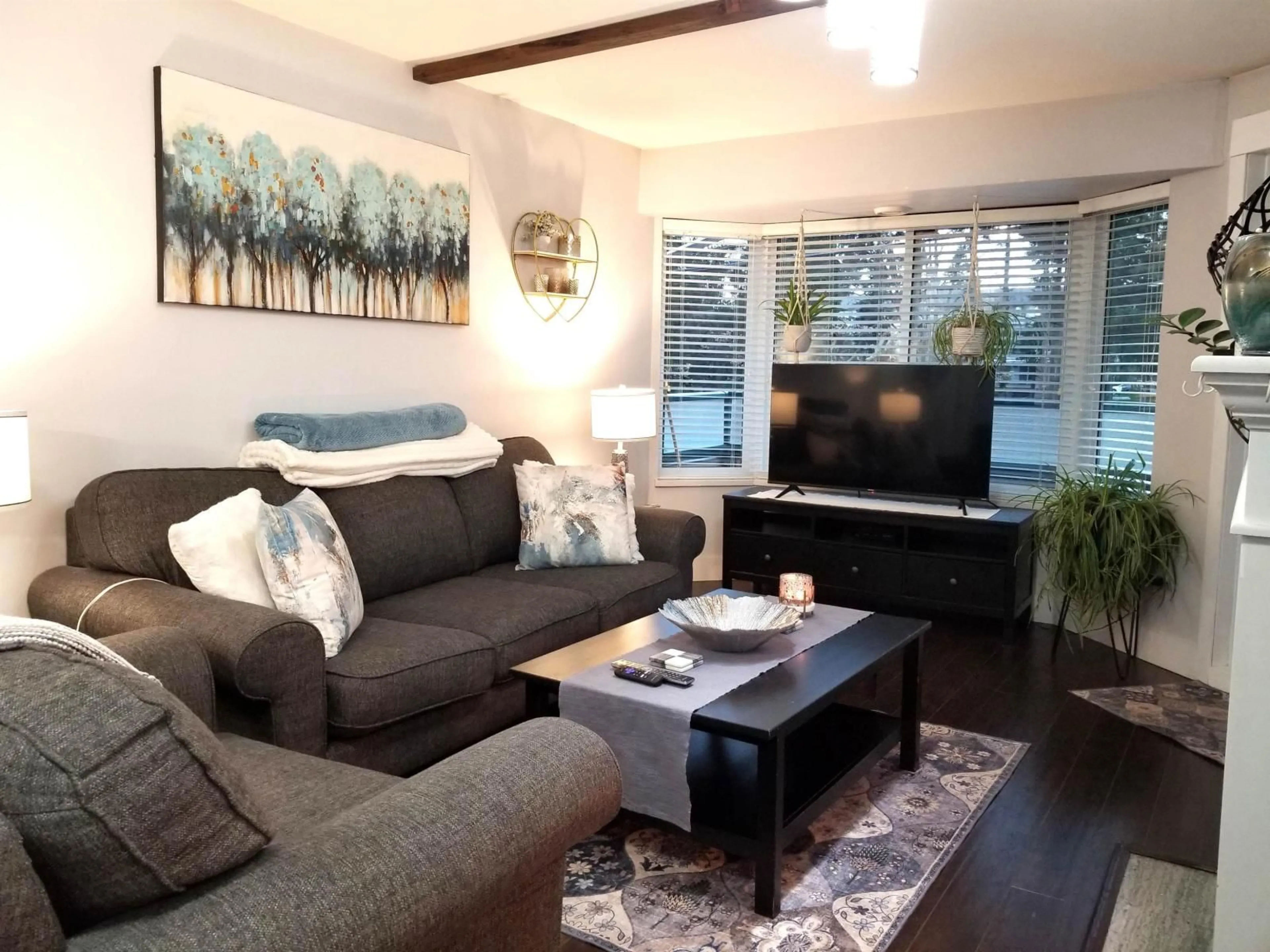 Living room with furniture, wood/laminate floor for 208 - 2964 TRETHEWEY STREET, Abbotsford British Columbia V2T6P4