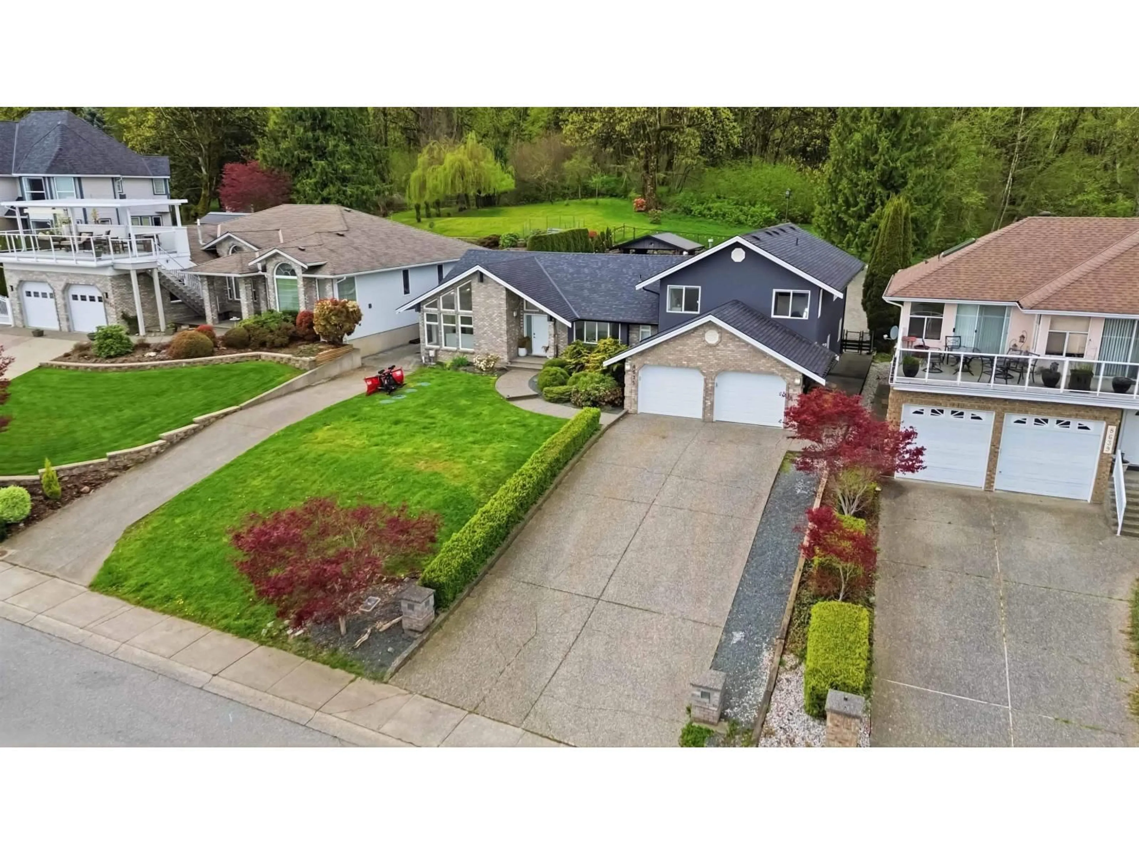 A pic from outside/outdoor area/front of a property/back of a property/a pic from drone, street for 8635 SUNRISE DRIVE, Chilliwack British Columbia V2R3H9
