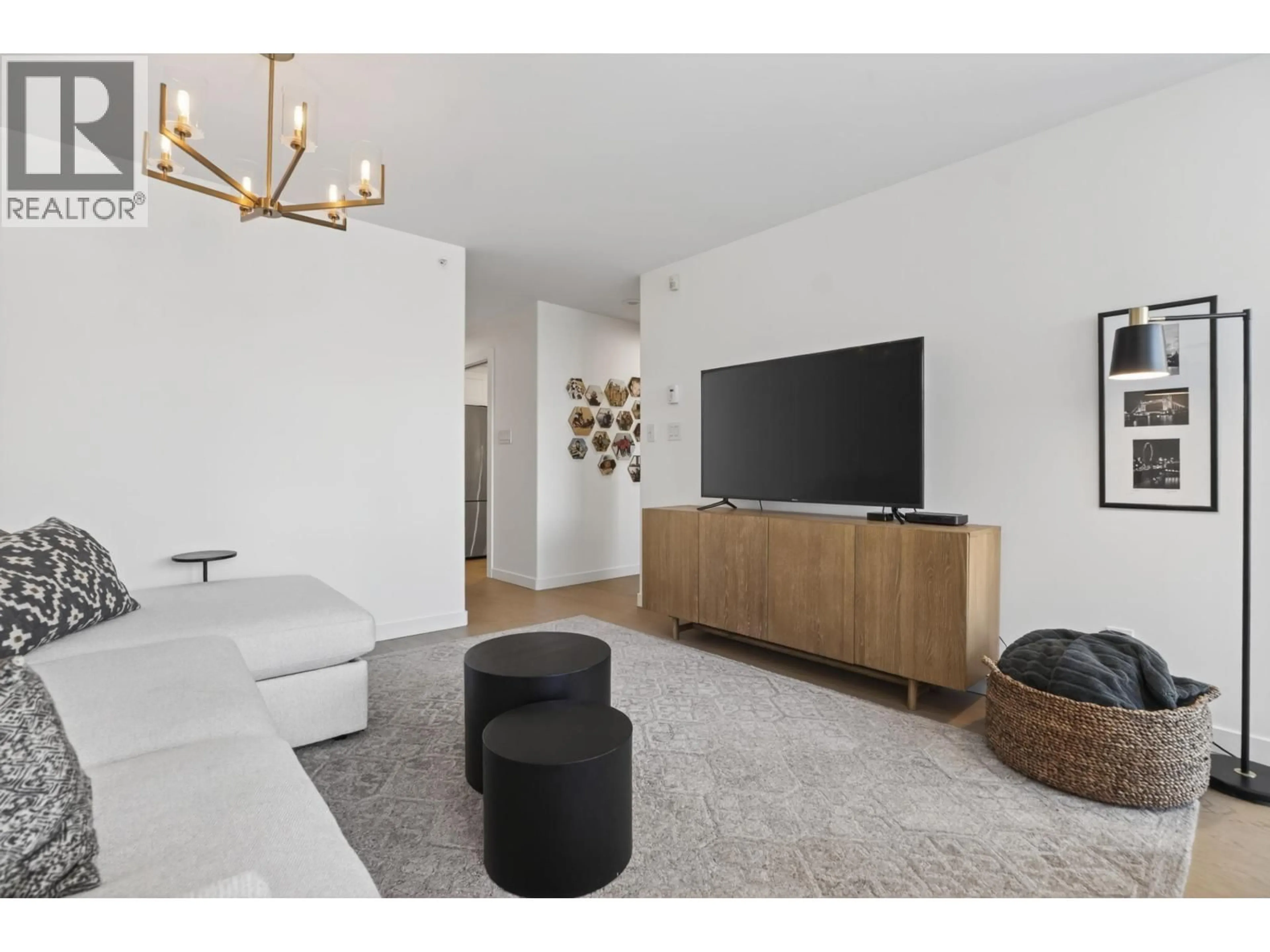 Living room with furniture, wood/laminate floor for 305 - 560 CARDERO STREET, Vancouver British Columbia V6G3E9