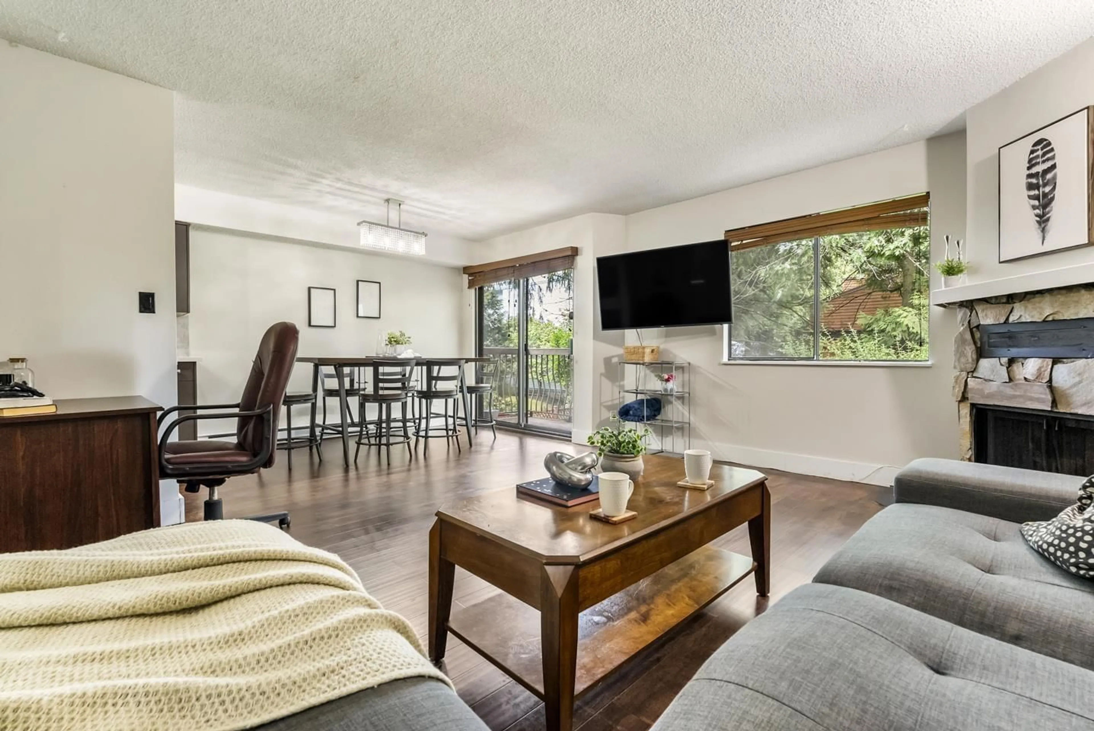 Living room with furniture, wood/laminate floor for 207 - 7144 133B STREET, Surrey British Columbia V3W8A4