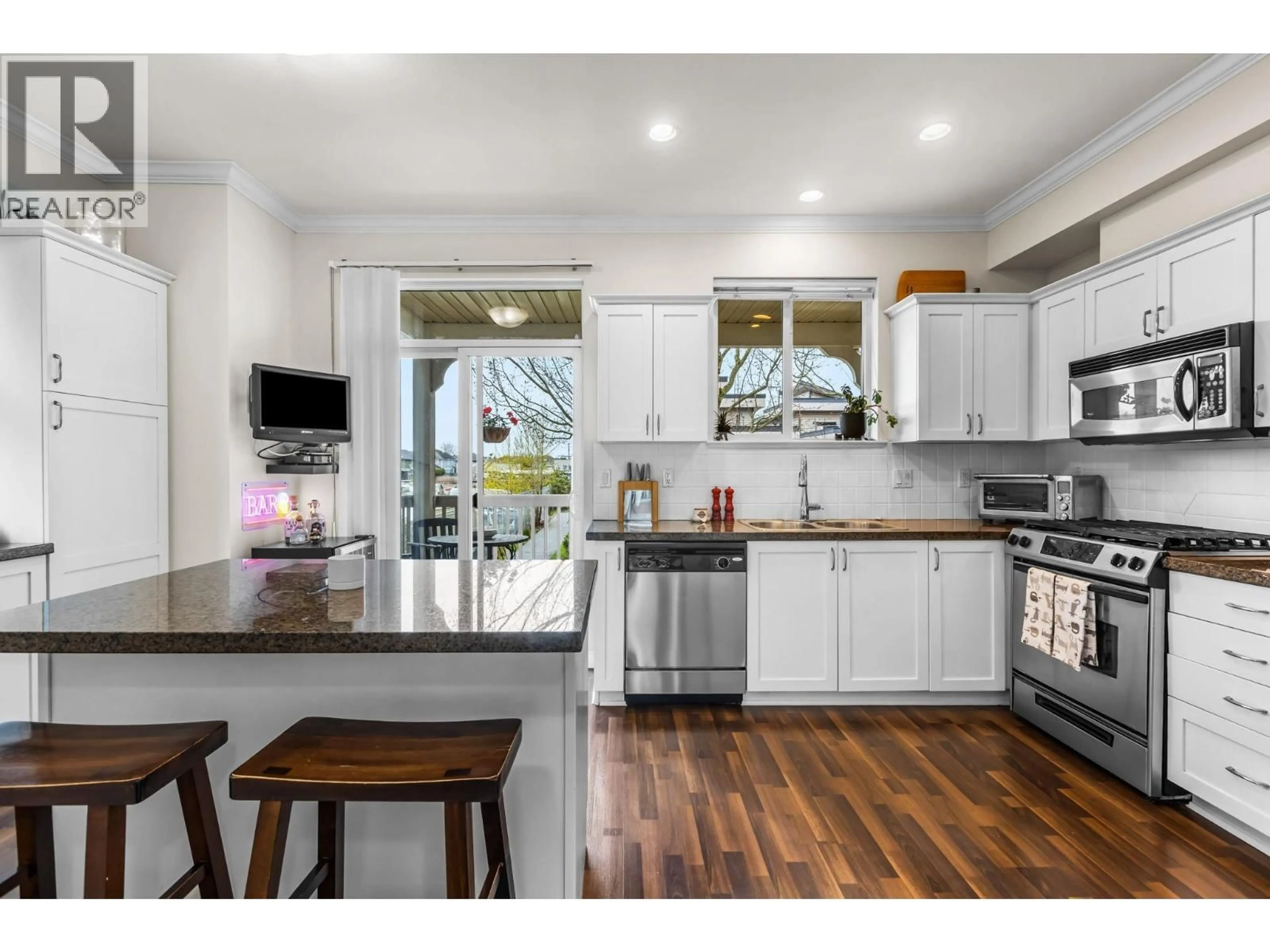 Open concept kitchen, wood/laminate floor for 14 - 12311 NO. 2 ROAD, Richmond British Columbia V7E0A1