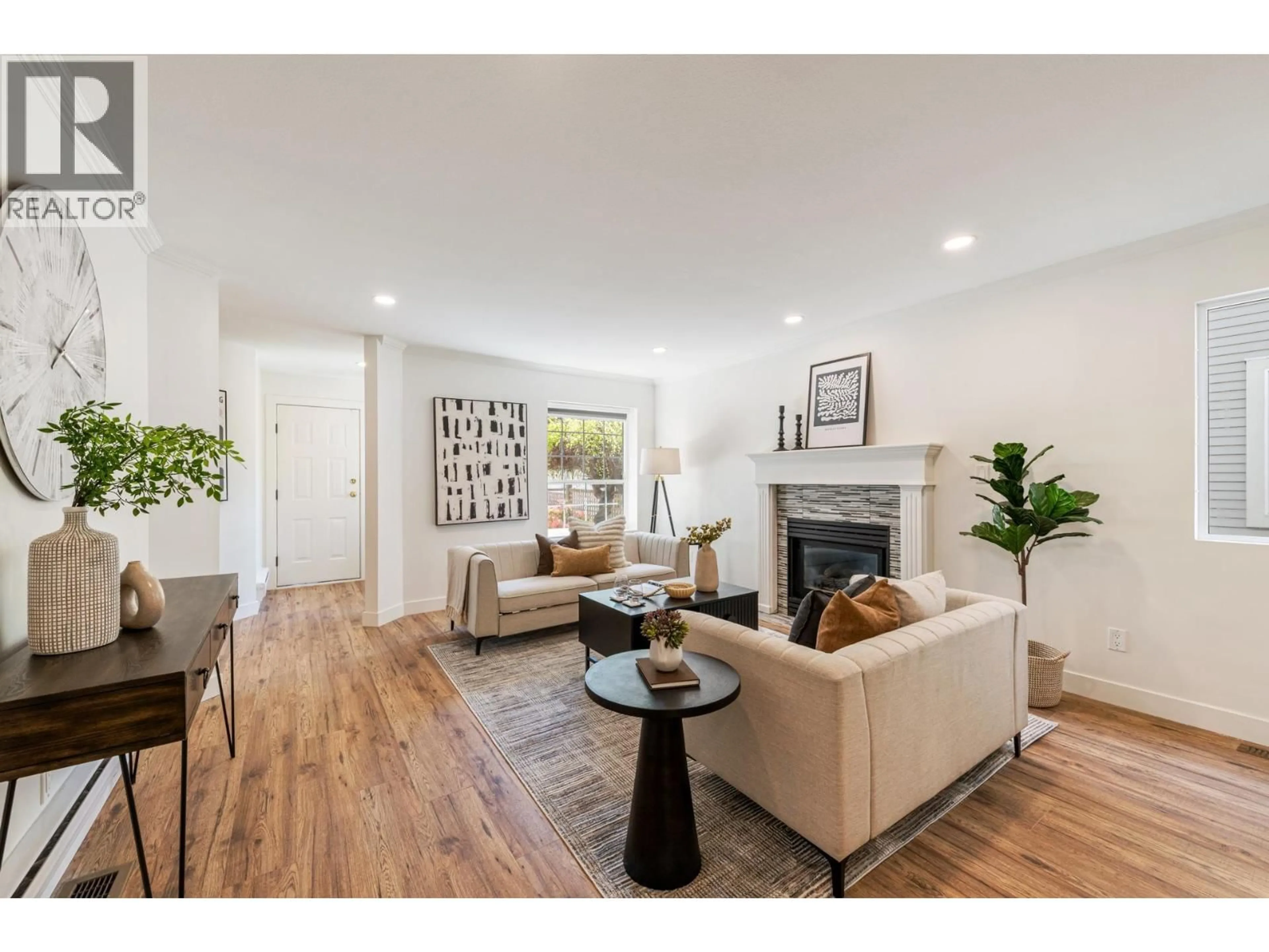 Living room with furniture, wood/laminate floor for 2111 PHILIP AVENUE, North Vancouver British Columbia V7P2W5