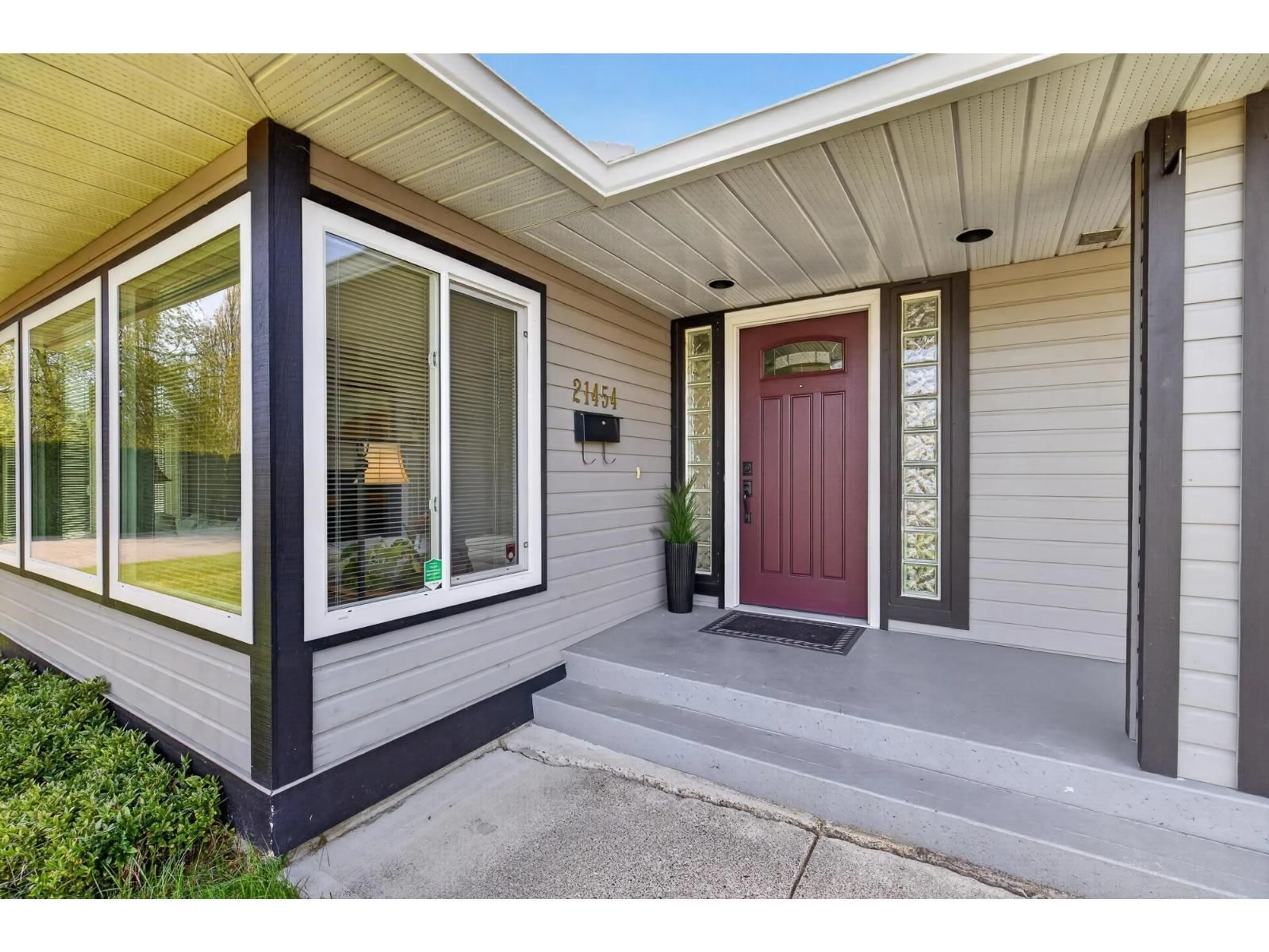 Home with vinyl exterior material, street for 21454 48A AVENUE, Langley British Columbia V3A9E5