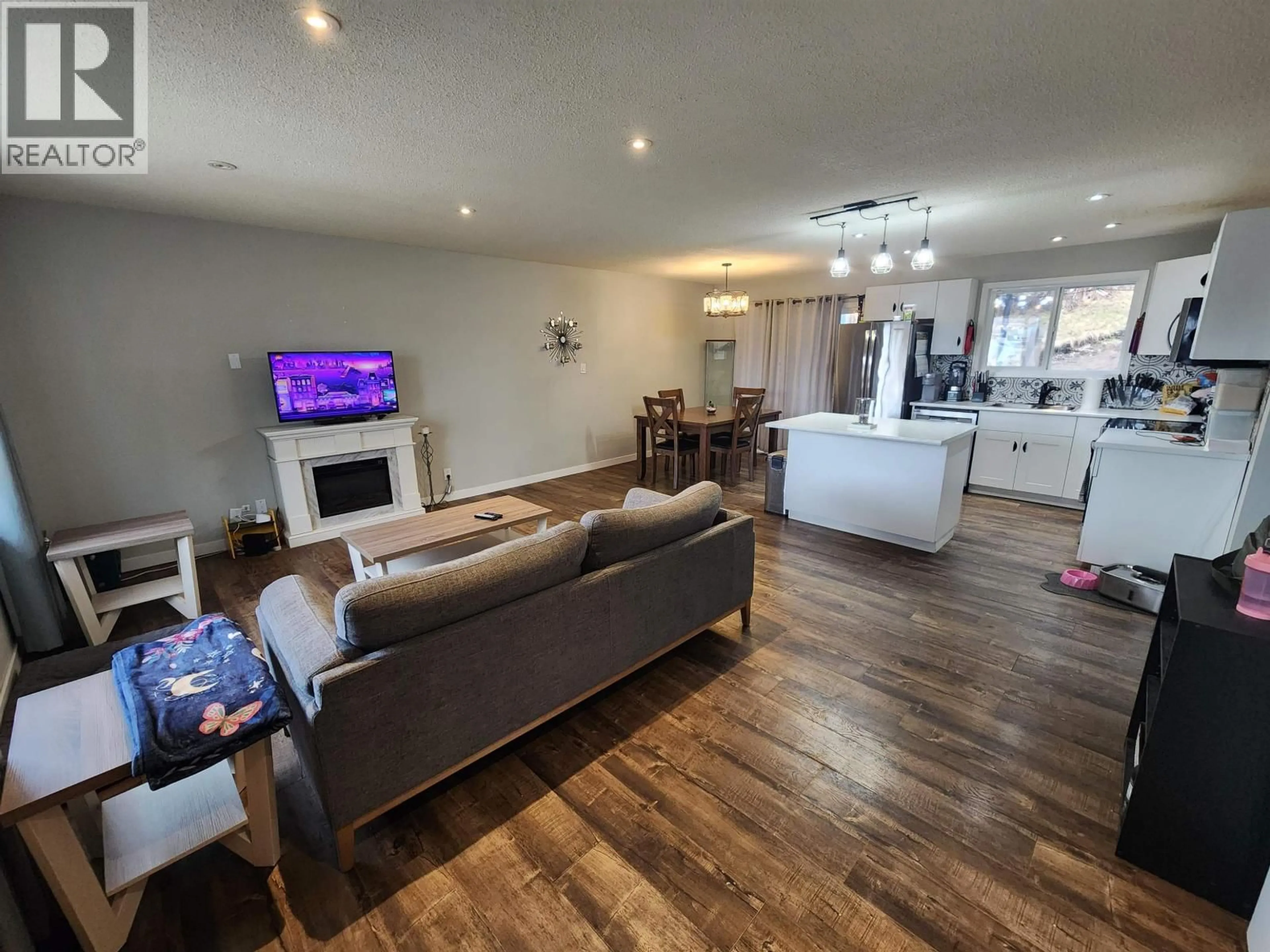 Living room with furniture, wood/laminate floor for 5801 BROCK DRIVE, Prince George British Columbia V2N2E3