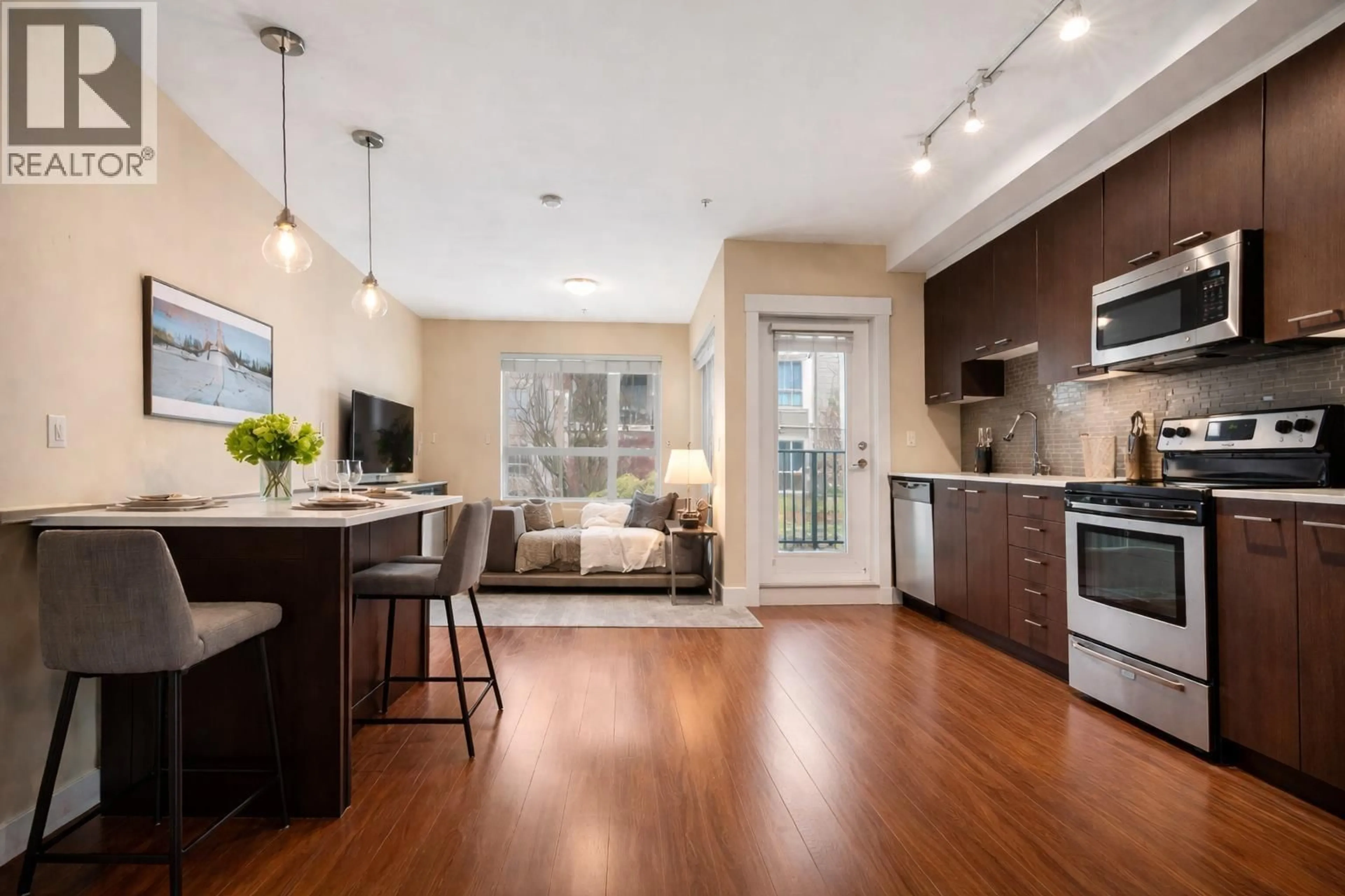Open concept kitchen, wood/laminate floor for 206 - 2473 ATKINS AVENUE, Port Coquitlam British Columbia V3C0C4