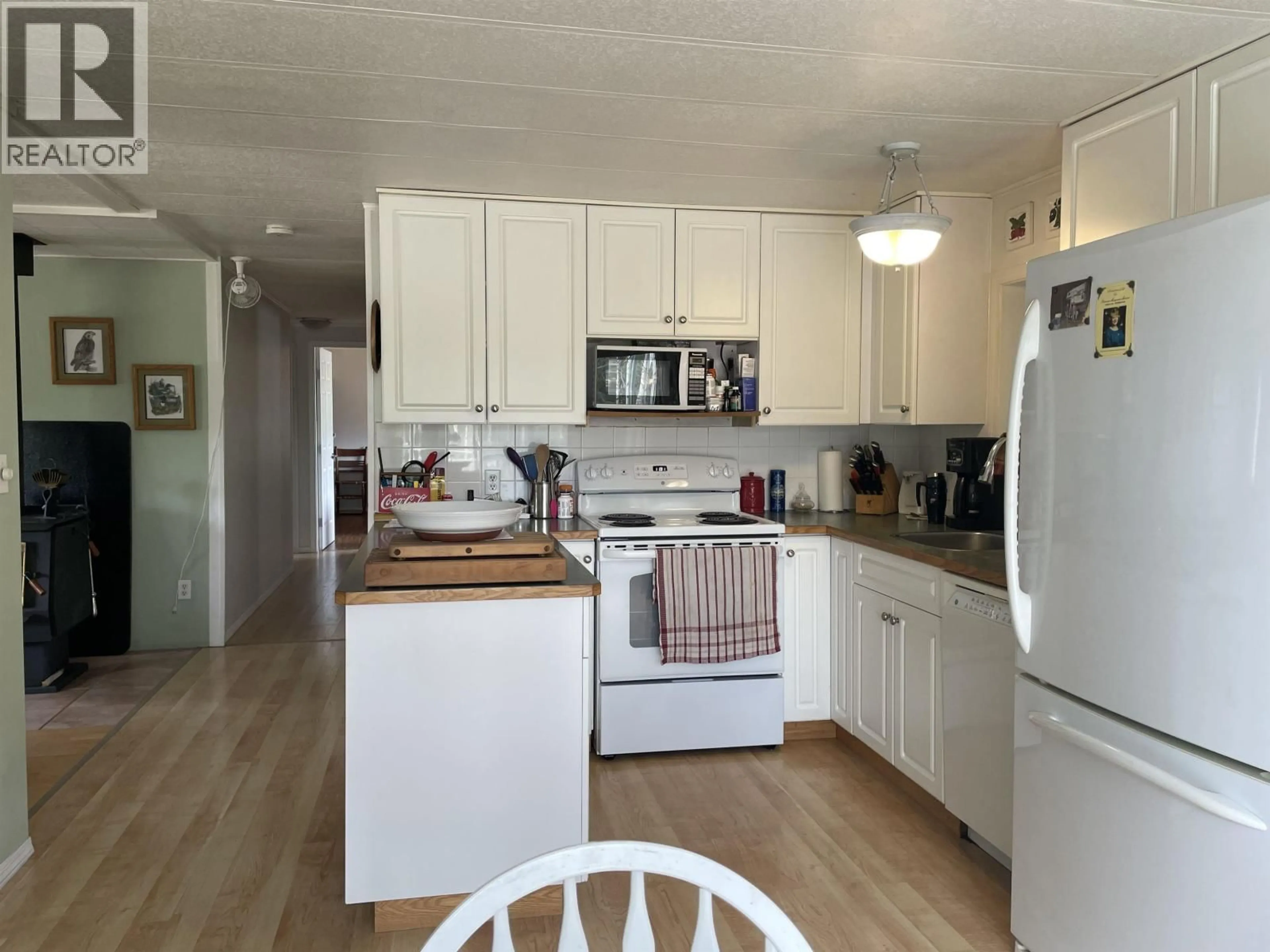 Standard kitchen, wood/laminate floor for 7008 HOLMES ROAD, Lone Butte British Columbia V0K1X1