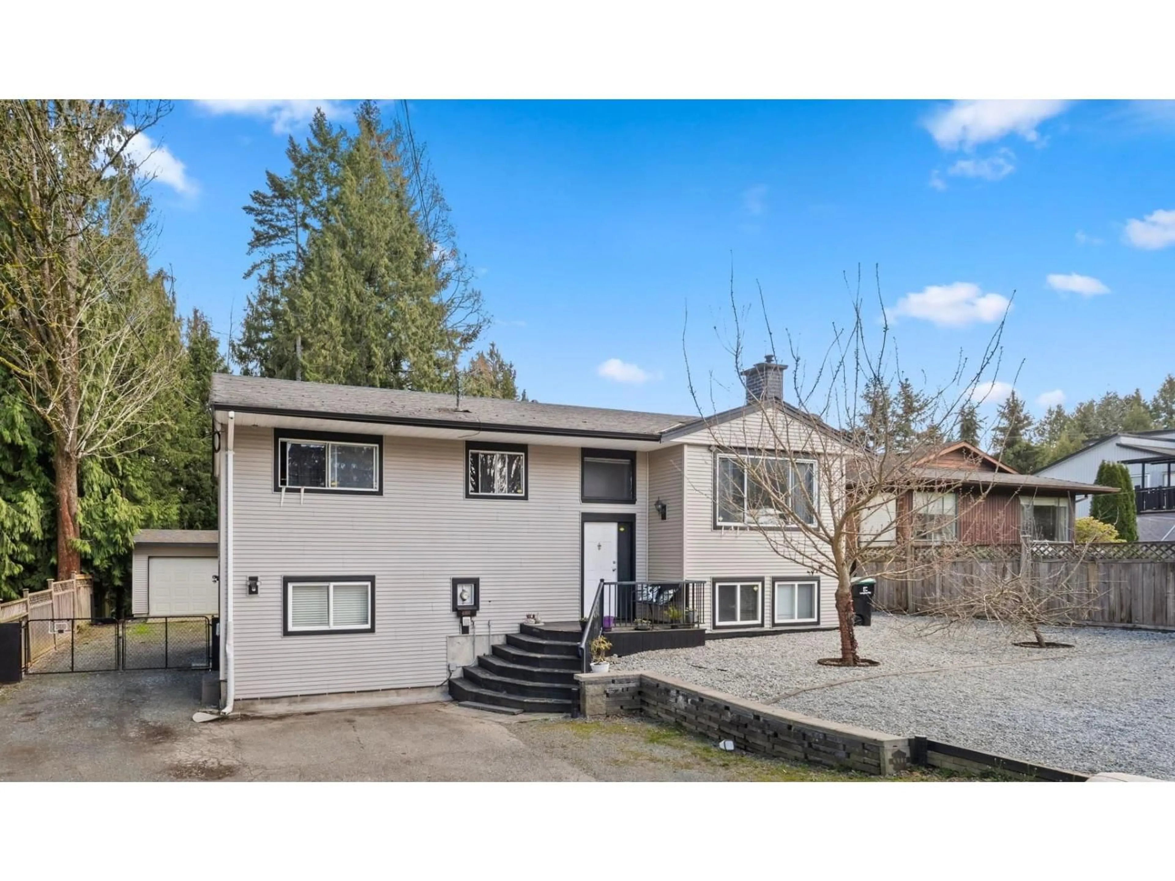 Home with vinyl exterior material, street for 4900 200TH STREET, Langley British Columbia V3A1L5