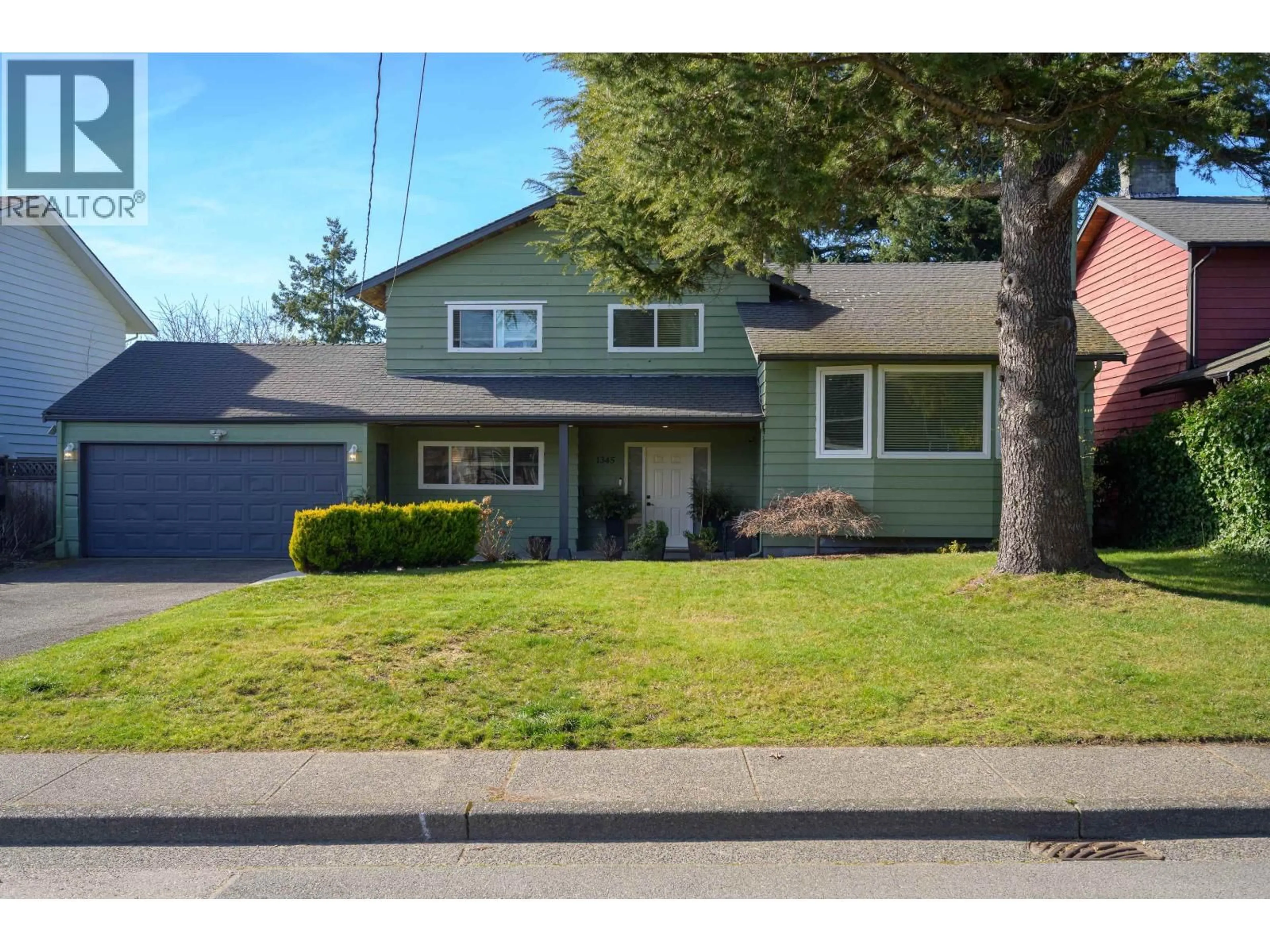 Home with vinyl exterior material, street for 1345 53A STREET, Delta British Columbia V4M3E8