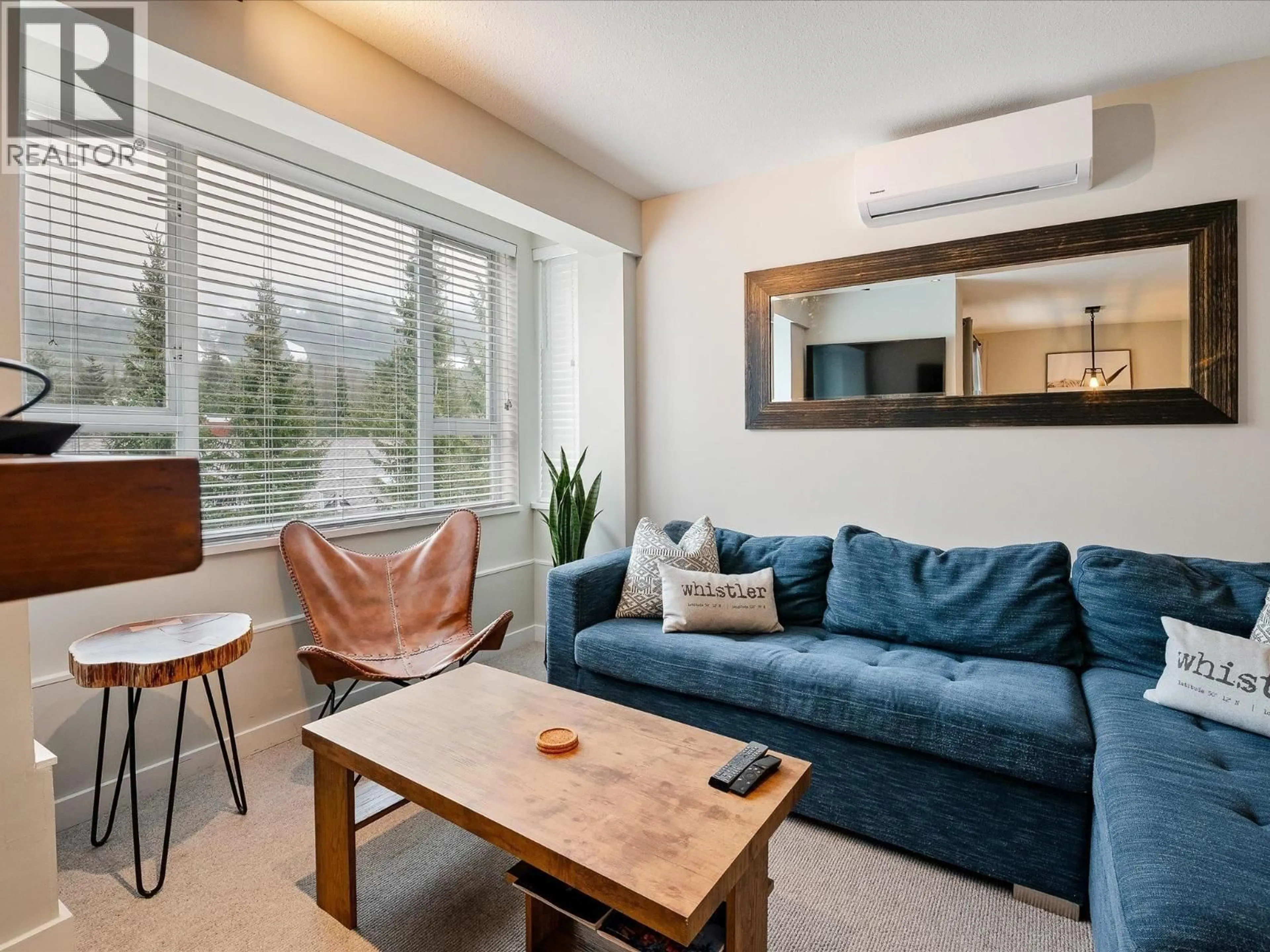 Living room with furniture, wood/laminate floor for 401 - 4314 MAIN STREET, Whistler British Columbia V8E1A8
