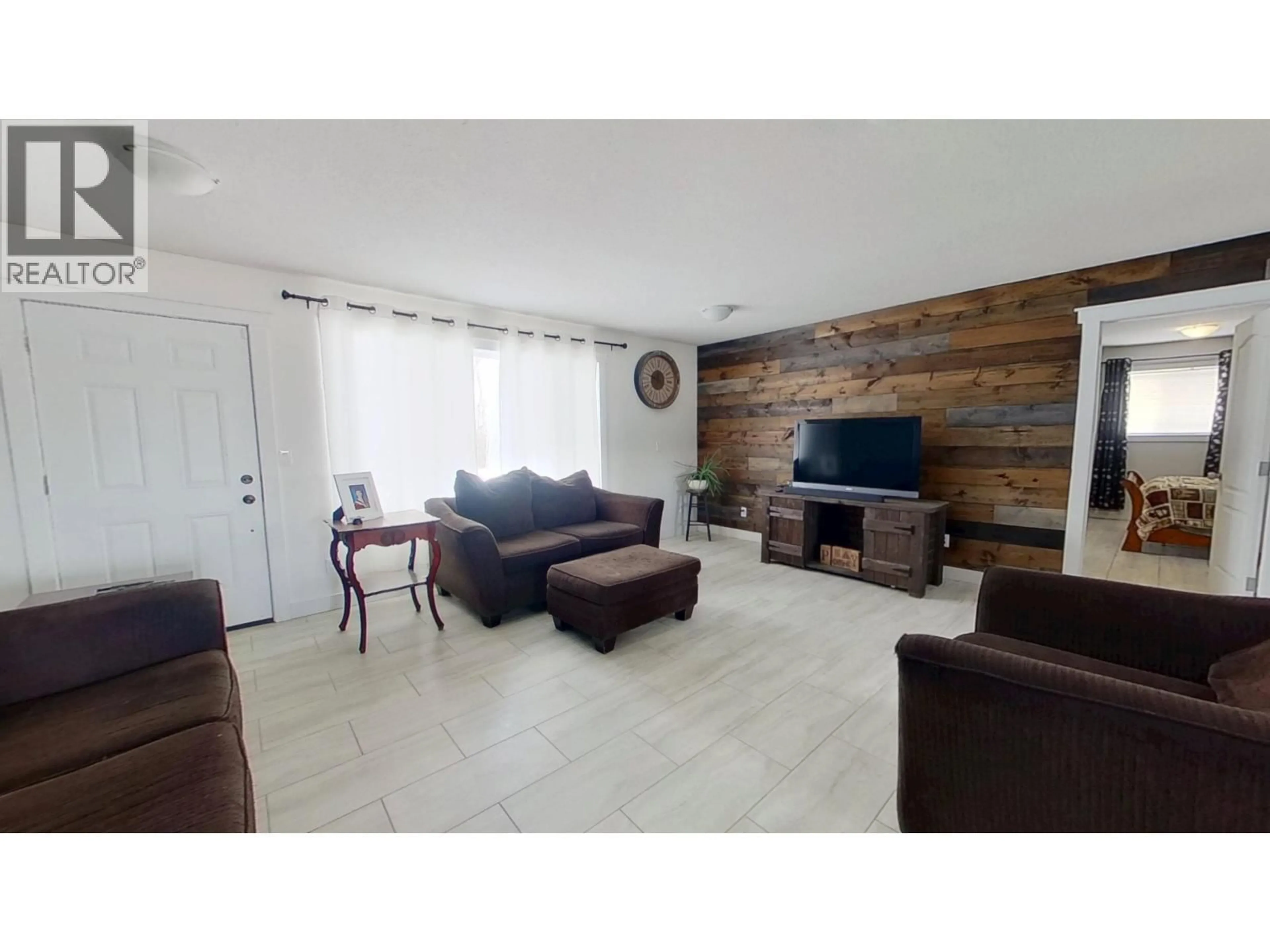 Living room with furniture, wood/laminate floor for 2291 CECIL LAKE ROAD, Fort St. John British Columbia V0C1G0