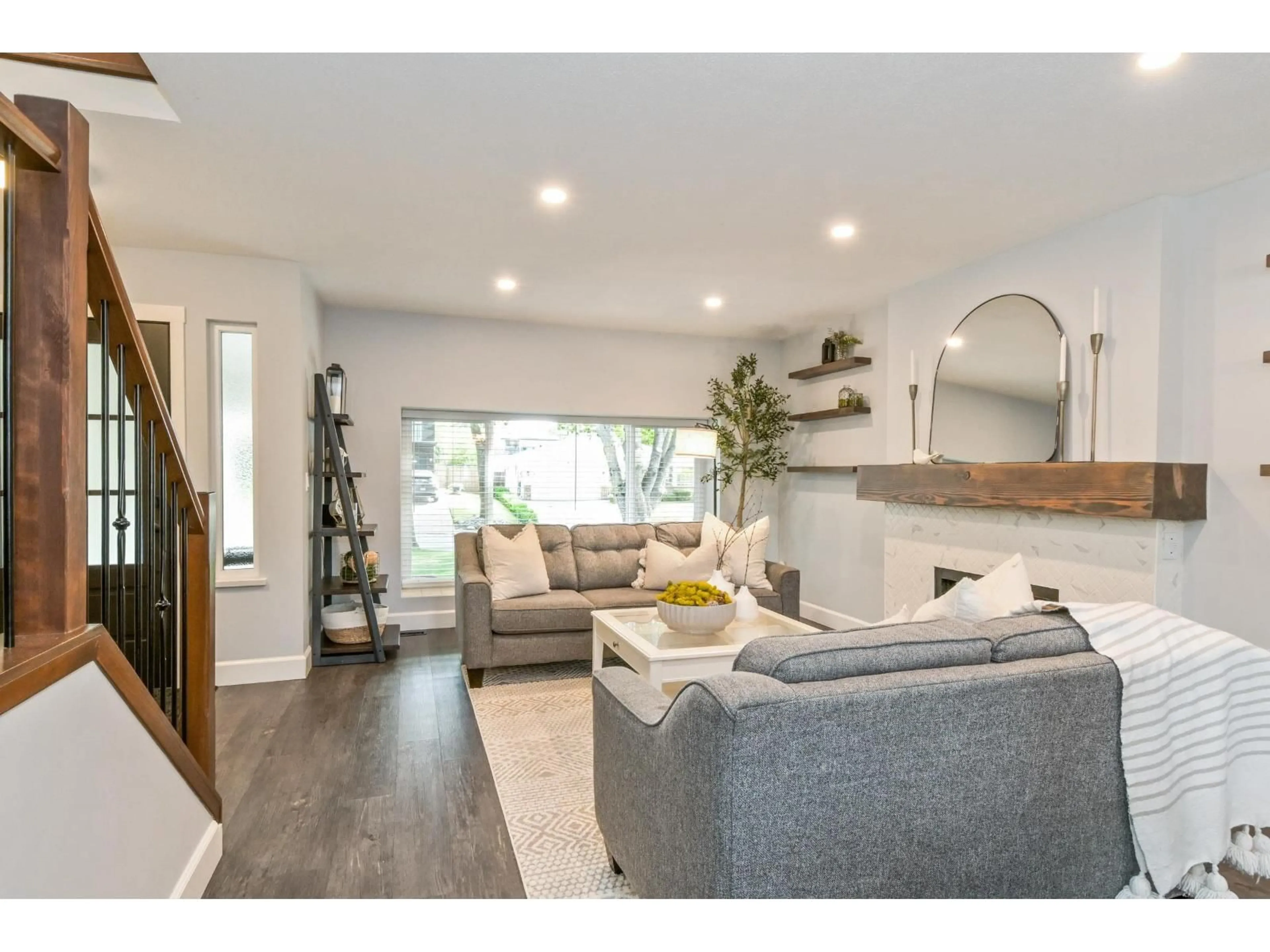 Living room with furniture, wood/laminate floor for 5865 169 STREET, Surrey British Columbia V3S7A1