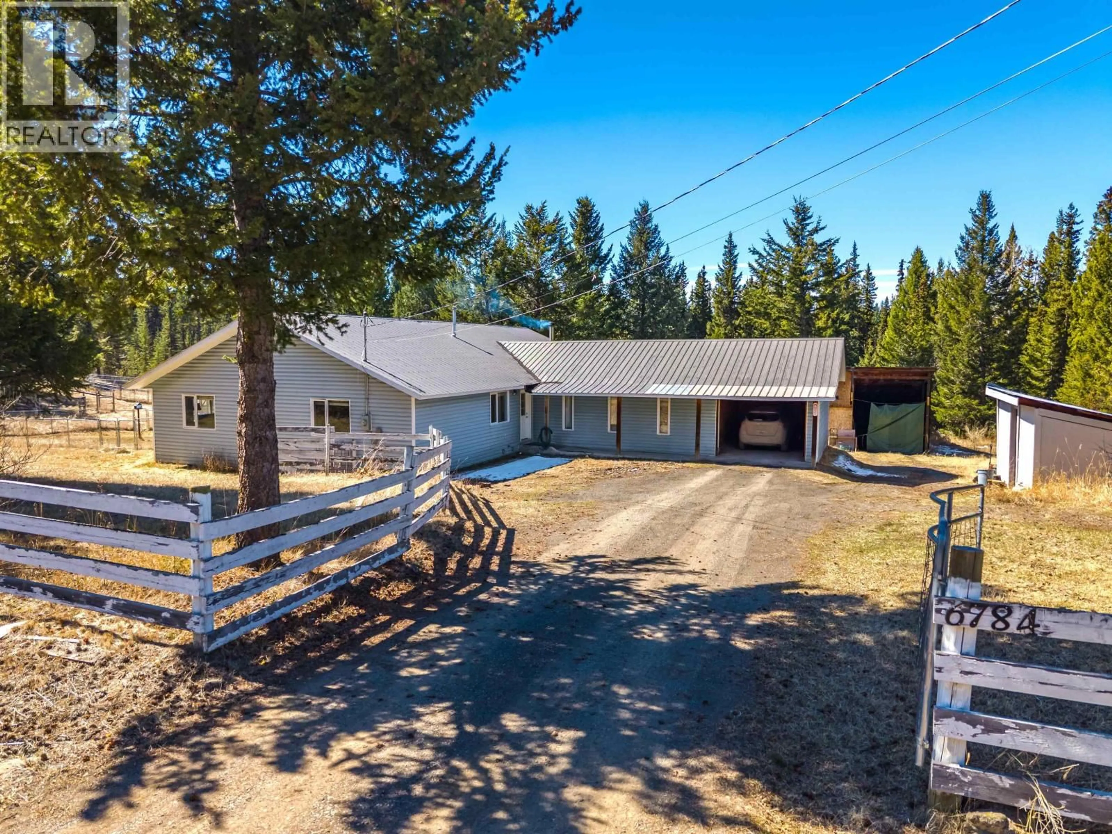 A pic from outside/outdoor area/front of a property/back of a property/a pic from drone, unknown for 6784 BARNETT ROAD, 100 Mile House British Columbia V0K2E2