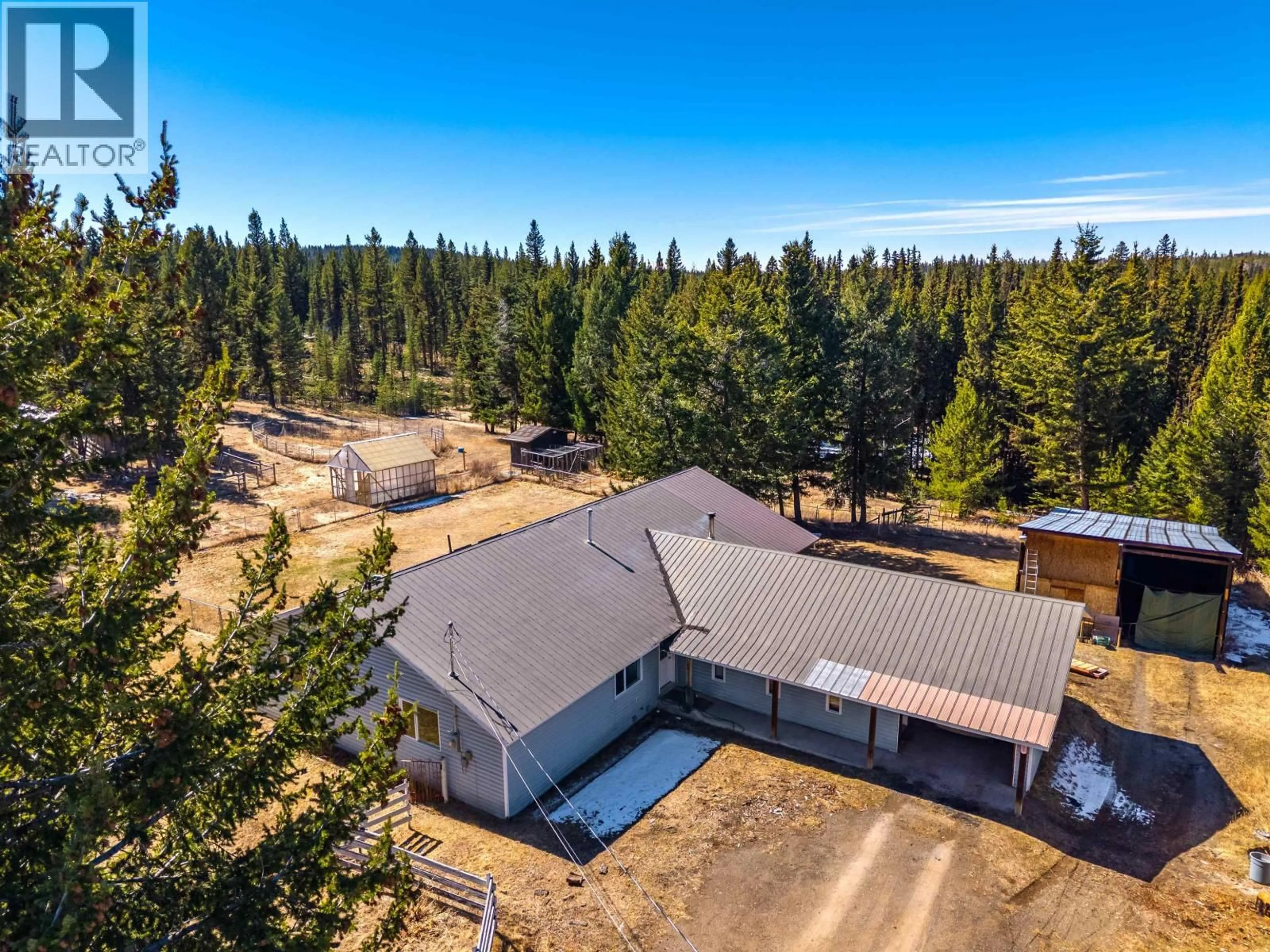 A pic from outside/outdoor area/front of a property/back of a property/a pic from drone, forest/trees view for 6784 BARNETT ROAD, 100 Mile House British Columbia V0K2E2