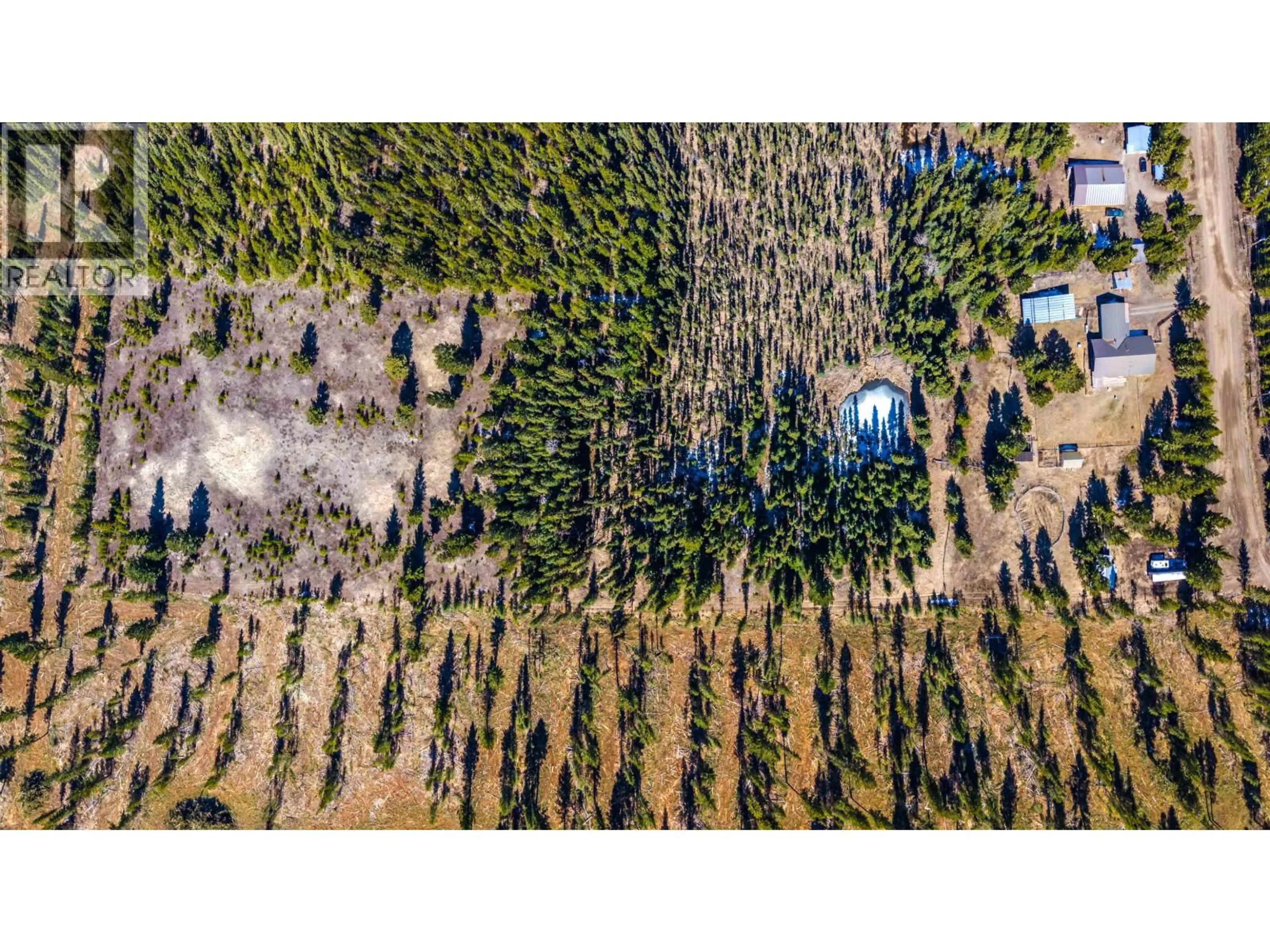 A pic from outside/outdoor area/front of a property/back of a property/a pic from drone, forest/trees view for 6784 BARNETT ROAD, 100 Mile House British Columbia V0K2E2