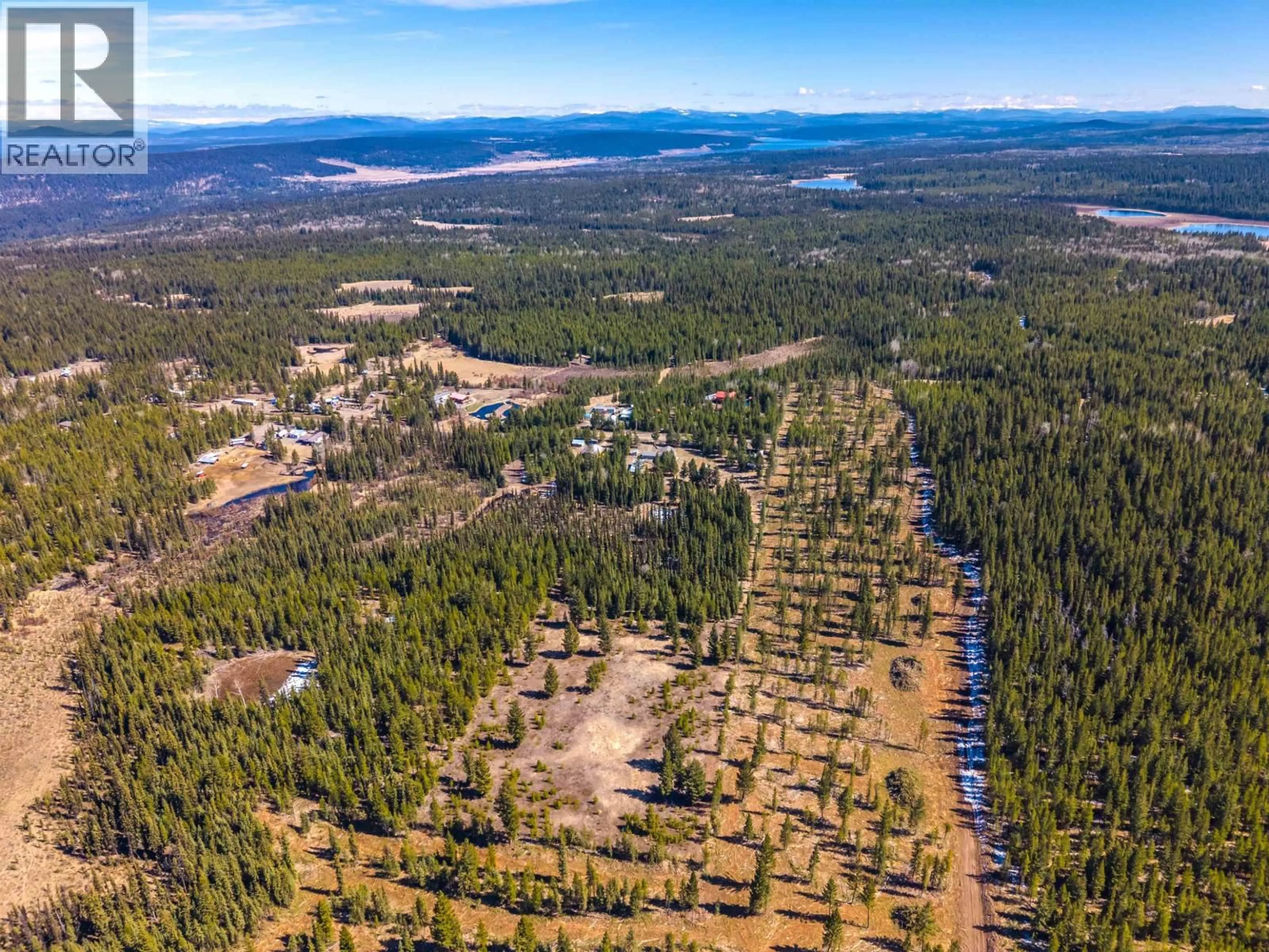 A pic from outside/outdoor area/front of a property/back of a property/a pic from drone, forest/trees view for 6784 BARNETT ROAD, 100 Mile House British Columbia V0K2E2