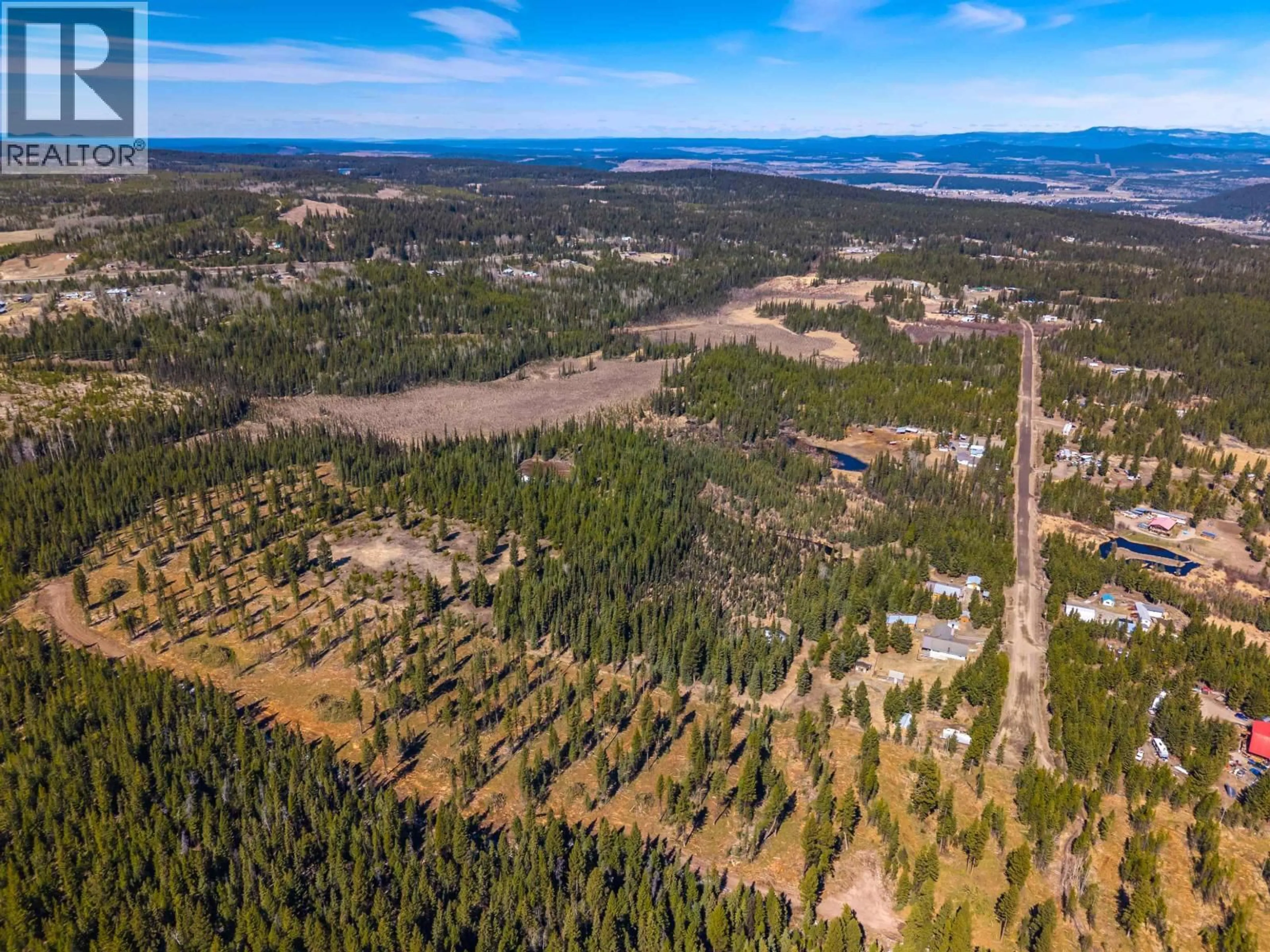 A pic from outside/outdoor area/front of a property/back of a property/a pic from drone, forest/trees view for 6784 BARNETT ROAD, 100 Mile House British Columbia V0K2E2