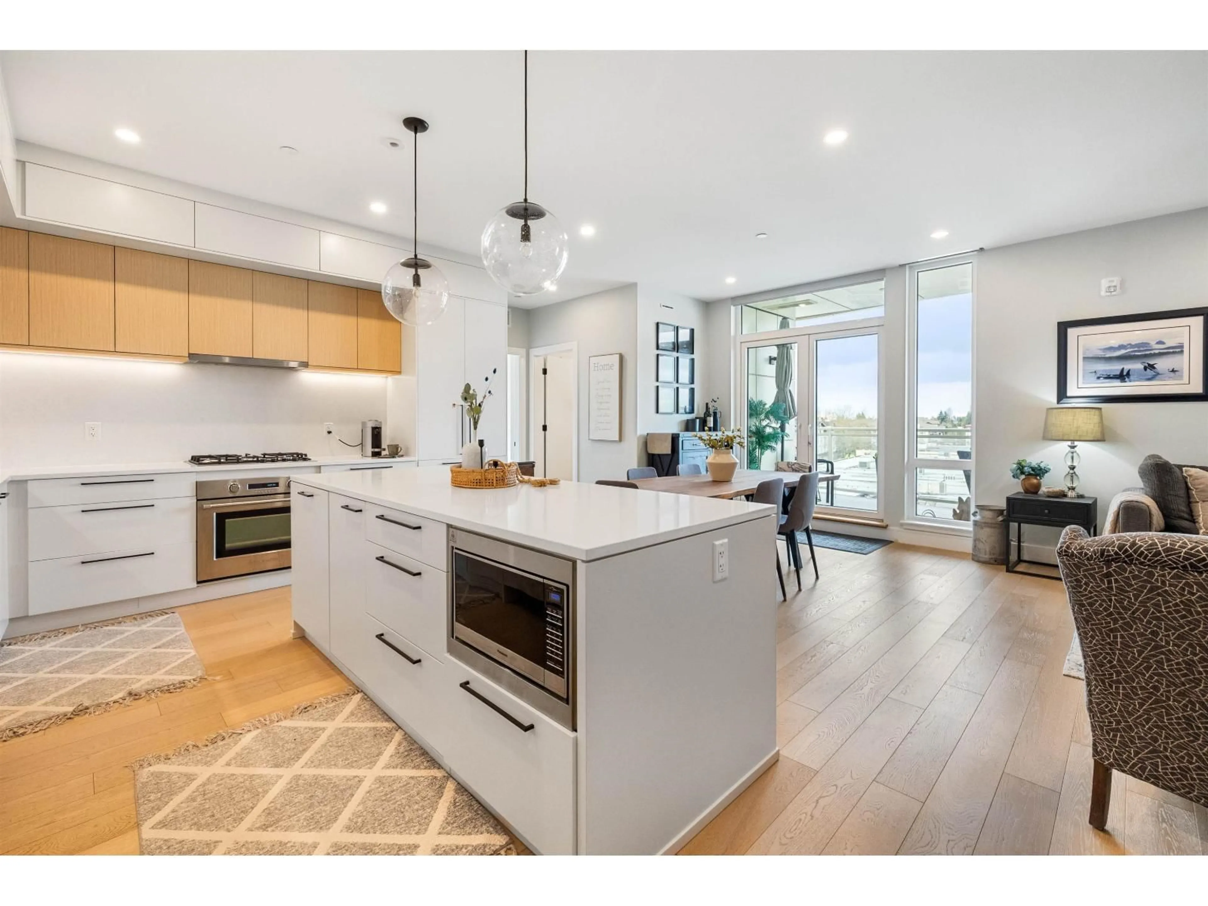 Open concept kitchen, wood/laminate floor for 509 - 20416 PARK AVENUE, Langley British Columbia V3A0N2