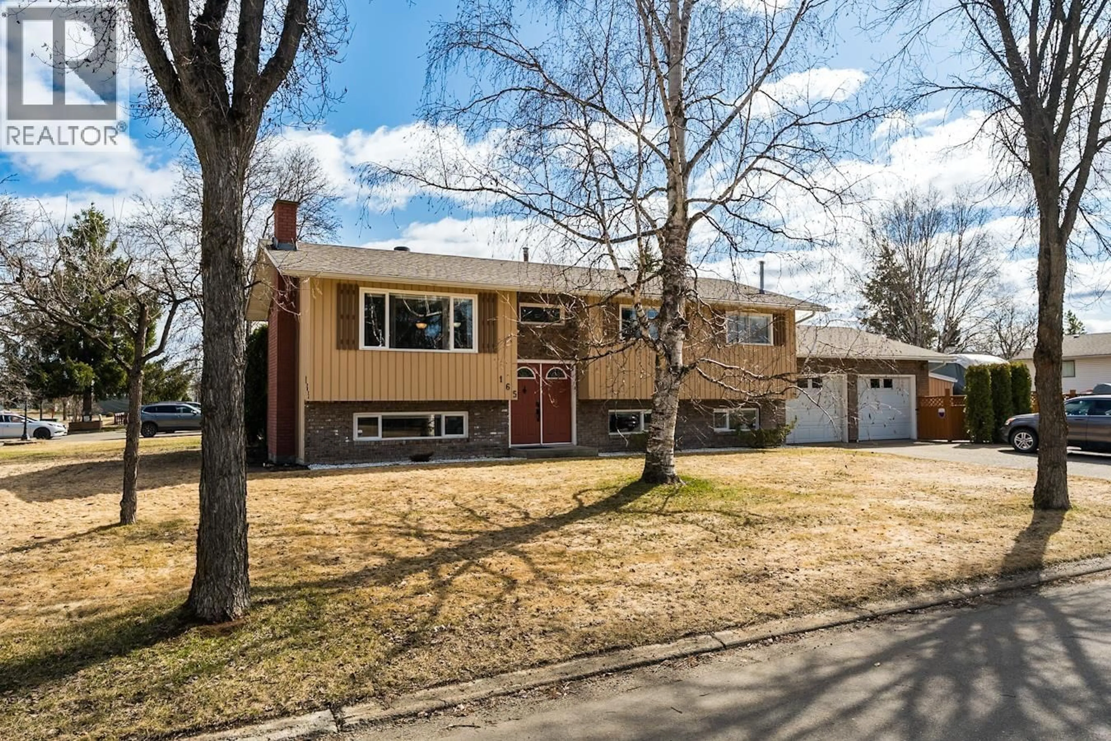 Home with vinyl exterior material, street for 165 NUGGET AVENUE, Prince George British Columbia V2M2M5