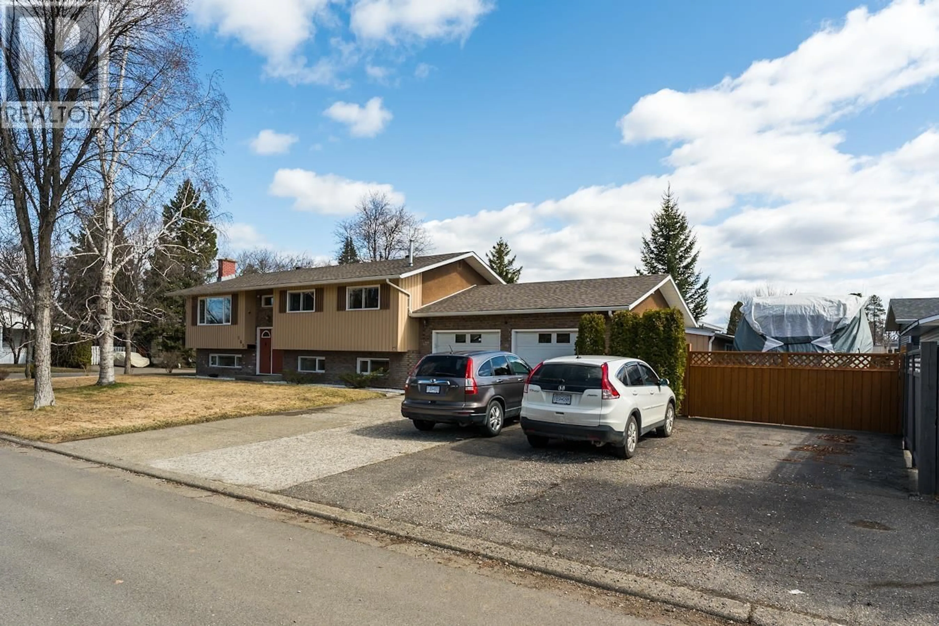 A pic from outside/outdoor area/front of a property/back of a property/a pic from drone, street for 165 NUGGET AVENUE, Prince George British Columbia V2M2M5