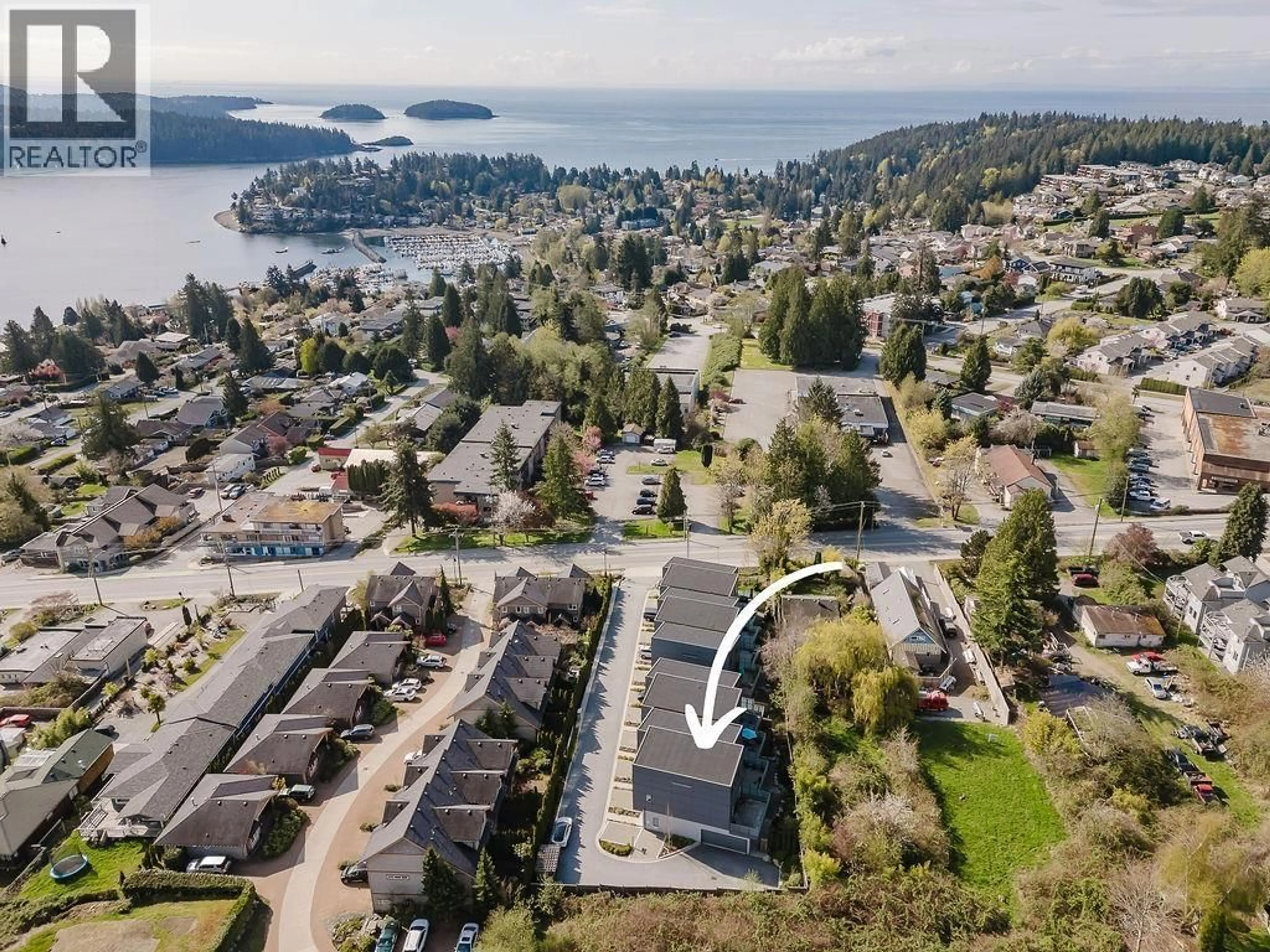 A pic from outside/outdoor area/front of a property/back of a property/a pic from drone, water/lake/river/ocean view for 109 - 736 GIBSONS WAY, Gibsons British Columbia V0N1V9