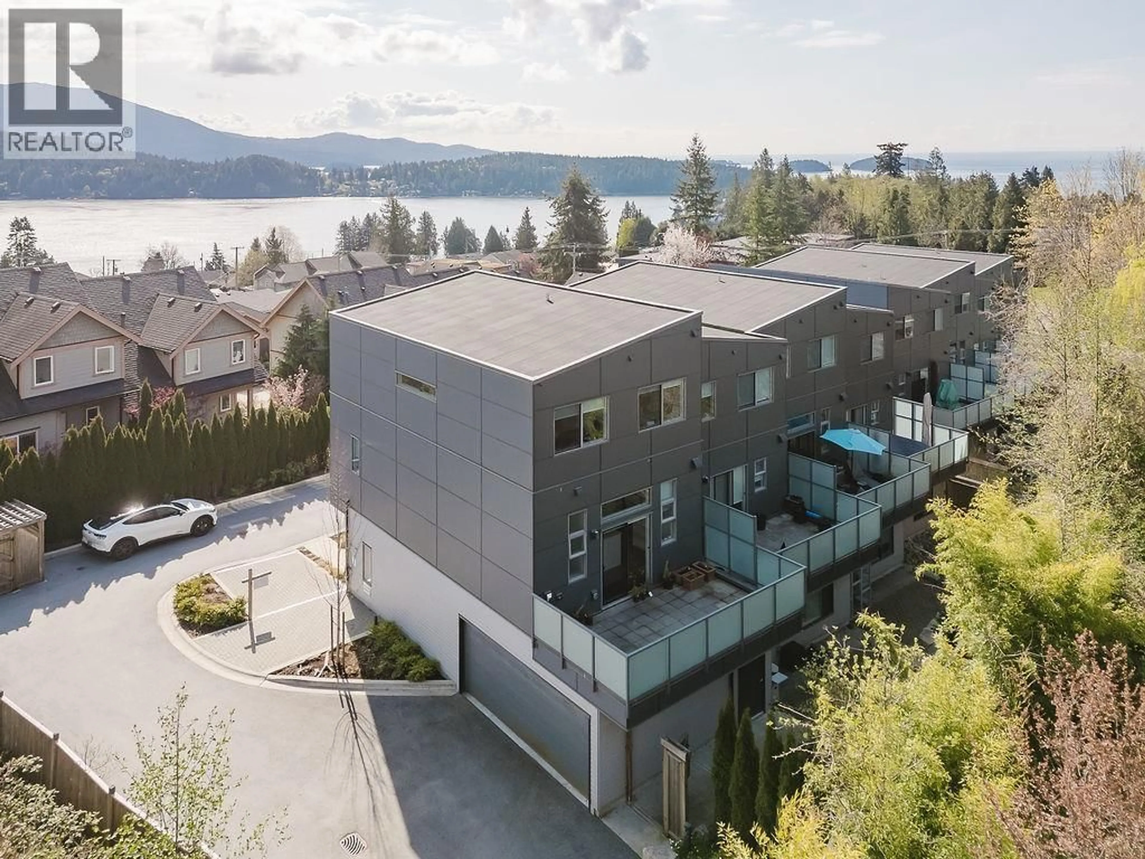 A pic from outside/outdoor area/front of a property/back of a property/a pic from drone, water/lake/river/ocean view for 109 - 736 GIBSONS WAY, Gibsons British Columbia V0N1V9