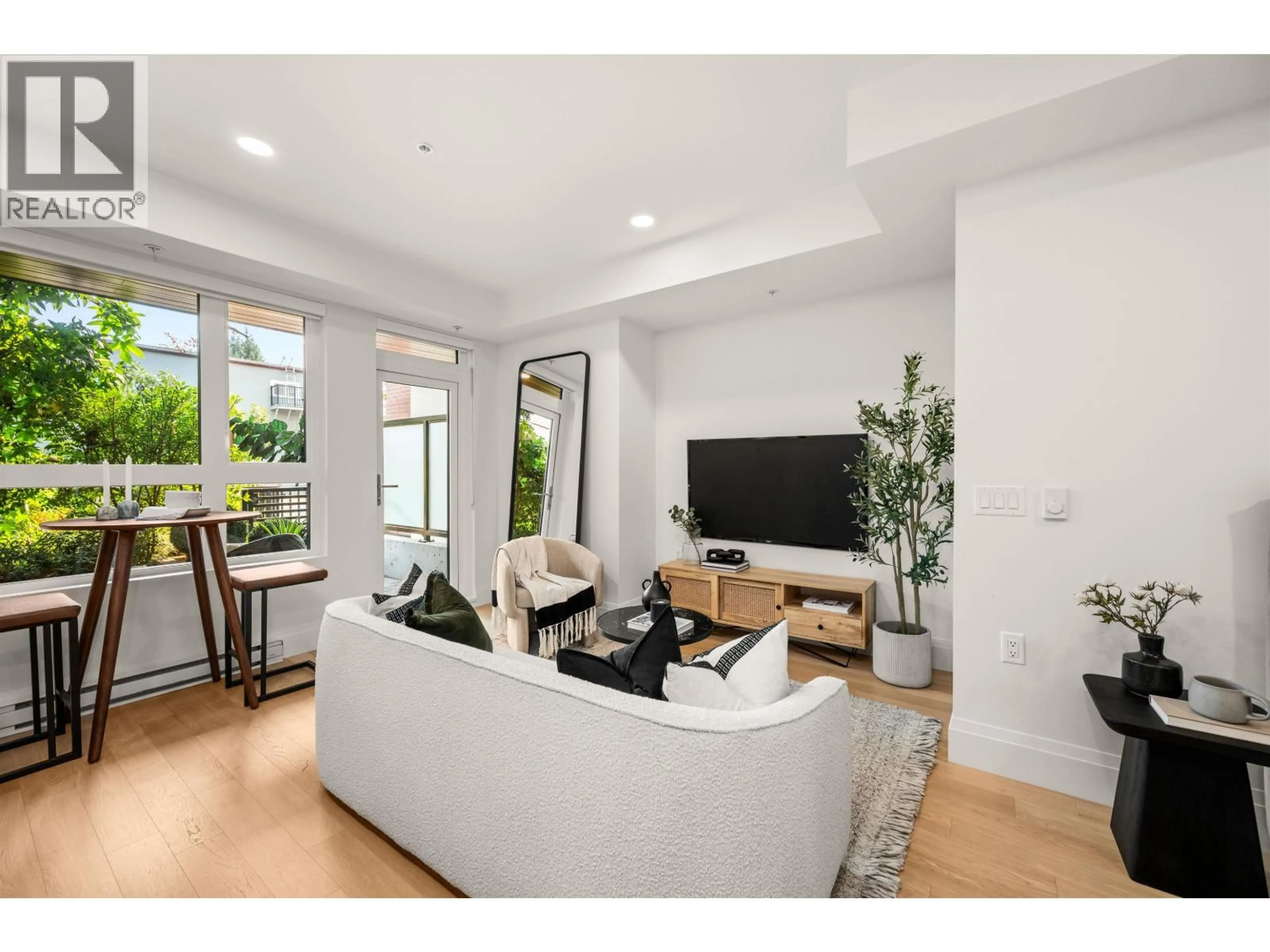 Living room with furniture, unknown for 106 - 2550 GARDEN DRIVE, Vancouver British Columbia V5N4X6