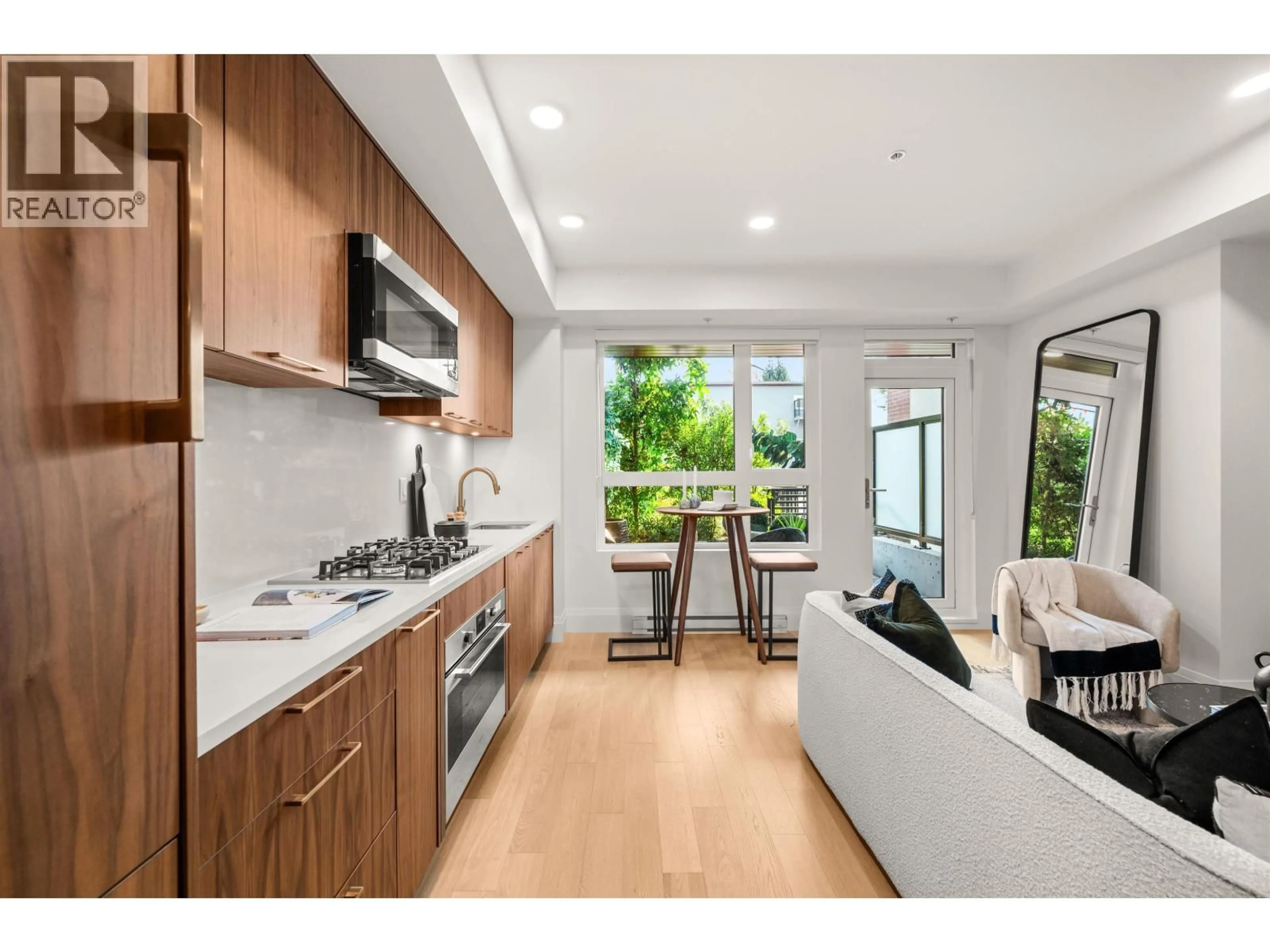 Open concept kitchen, unknown for 106 - 2550 GARDEN DRIVE, Vancouver British Columbia V5N4X6