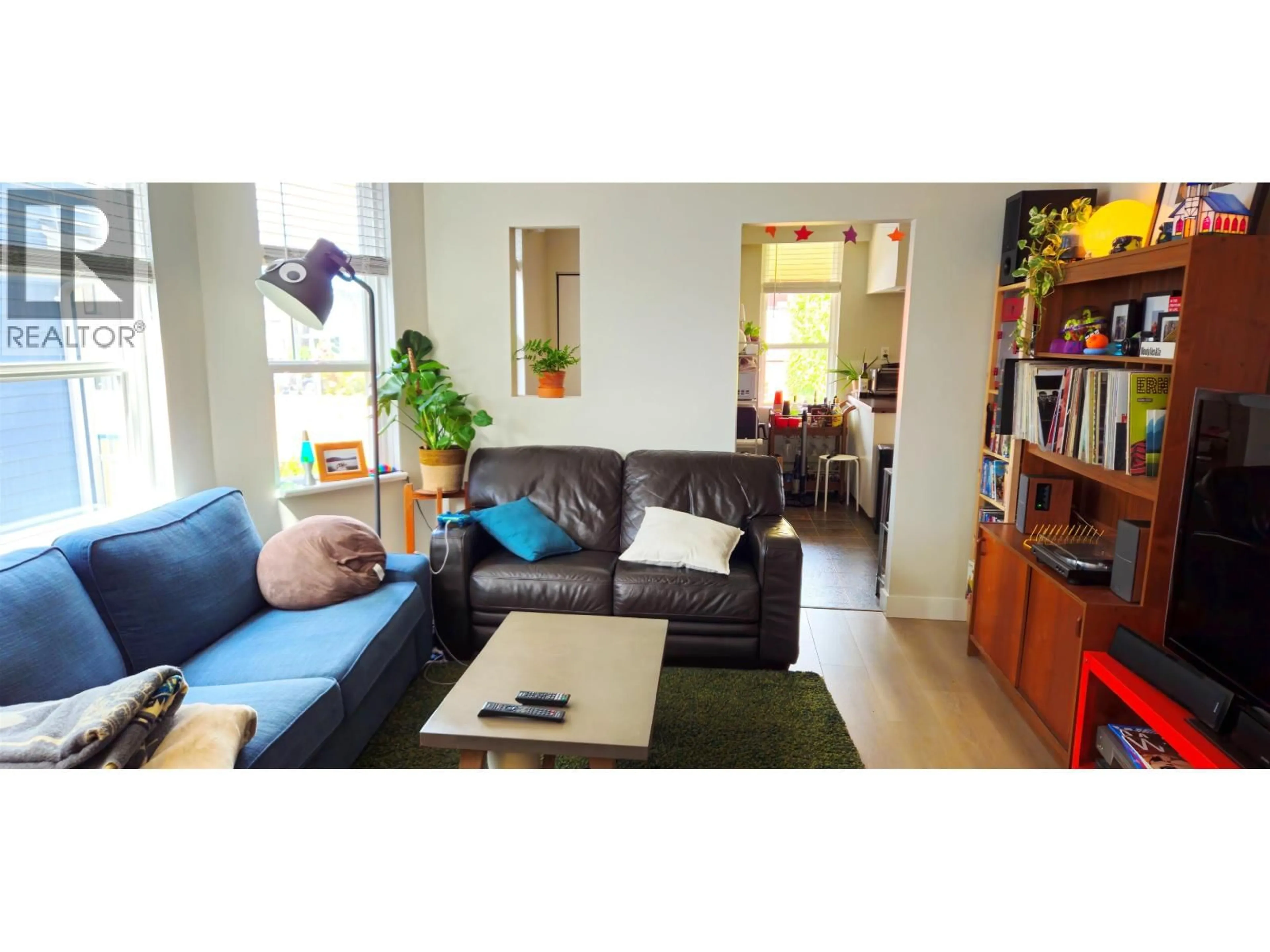 Living room with furniture, wood/laminate floor for 1745 GRAVELEY STREET, Vancouver British Columbia V5L3A9