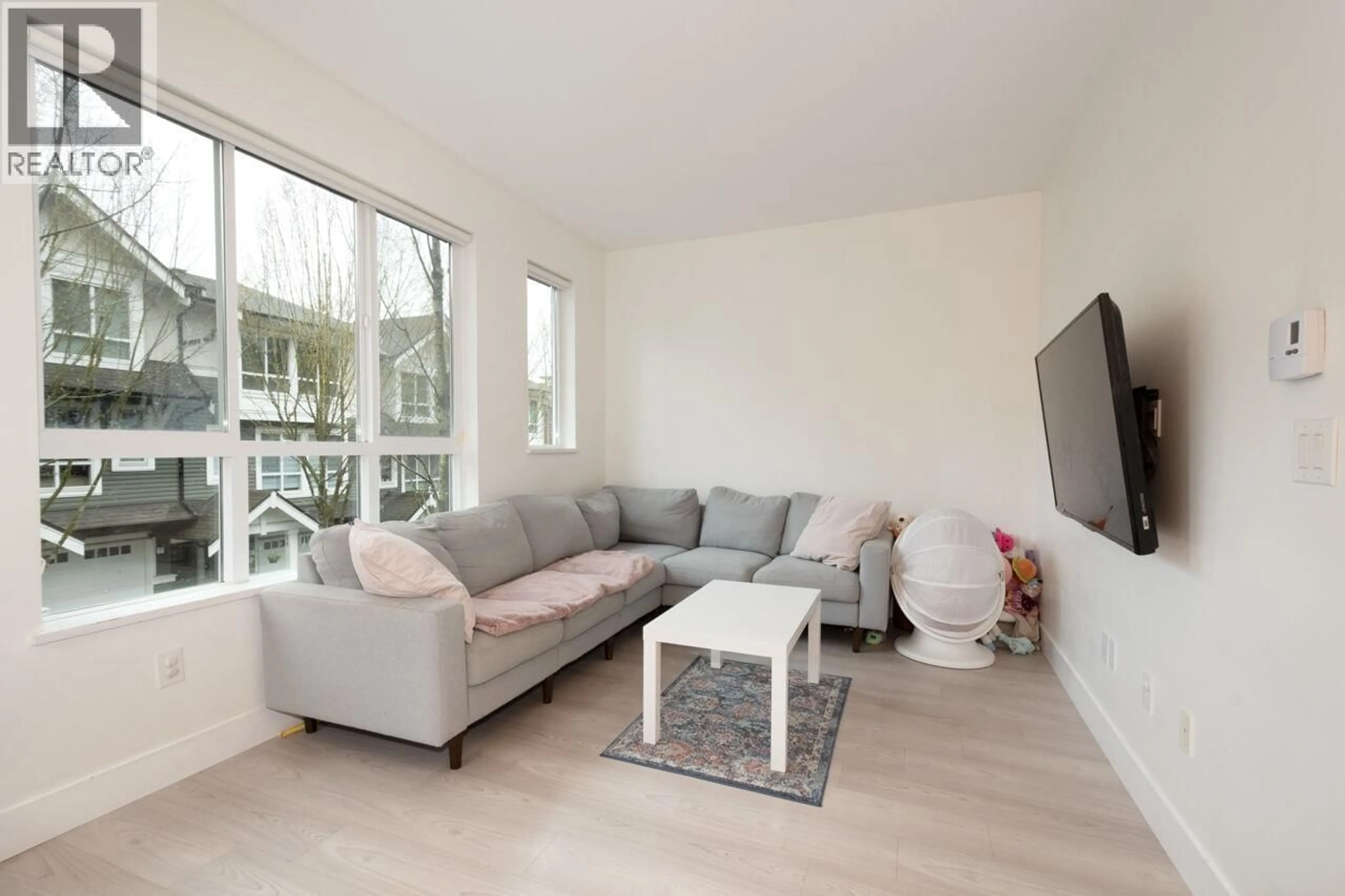 Living room with furniture, wood/laminate floor for 116 - 1460 SOUTHVIEW STREET, Coquitlam British Columbia V3E0G6