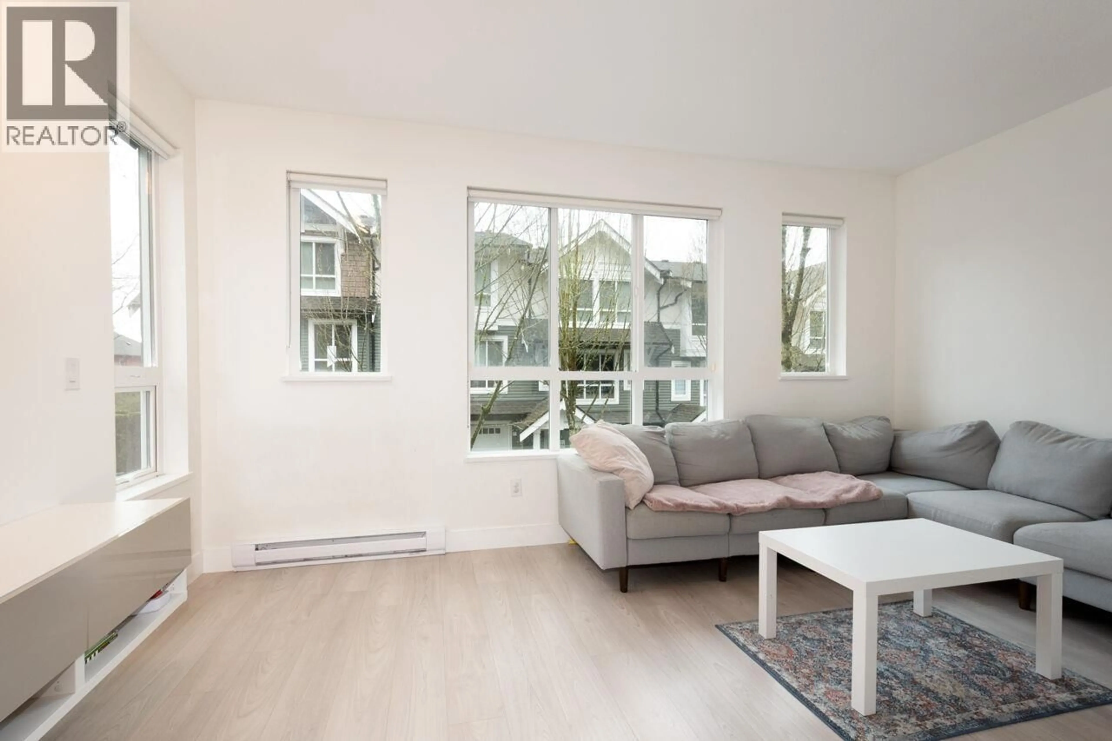 Living room with furniture, wood/laminate floor for 116 - 1460 SOUTHVIEW STREET, Coquitlam British Columbia V3E0G6