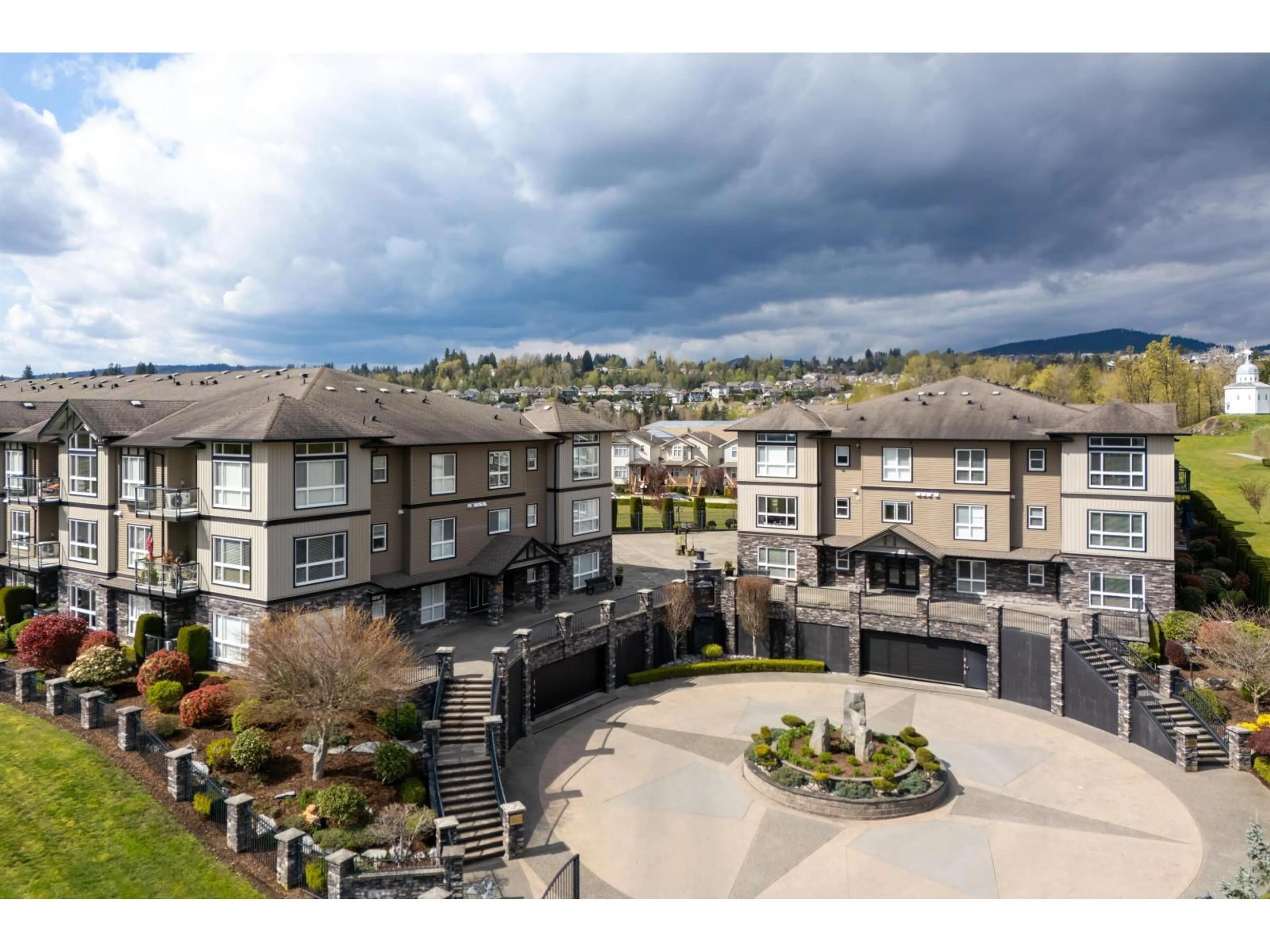 A pic from outside/outdoor area/front of a property/back of a property/a pic from drone, mountain view for A119 - 33755 7 AVENUE, Mission British Columbia V2V0A4